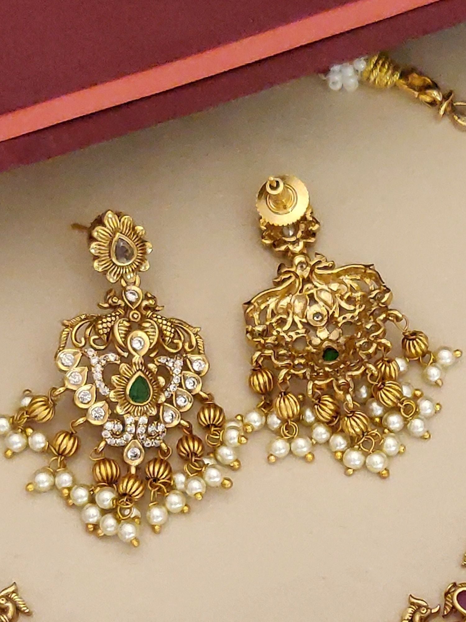 Traditional gold plated necklace set with intricate design and pearl accents by Abdesignsjewellery