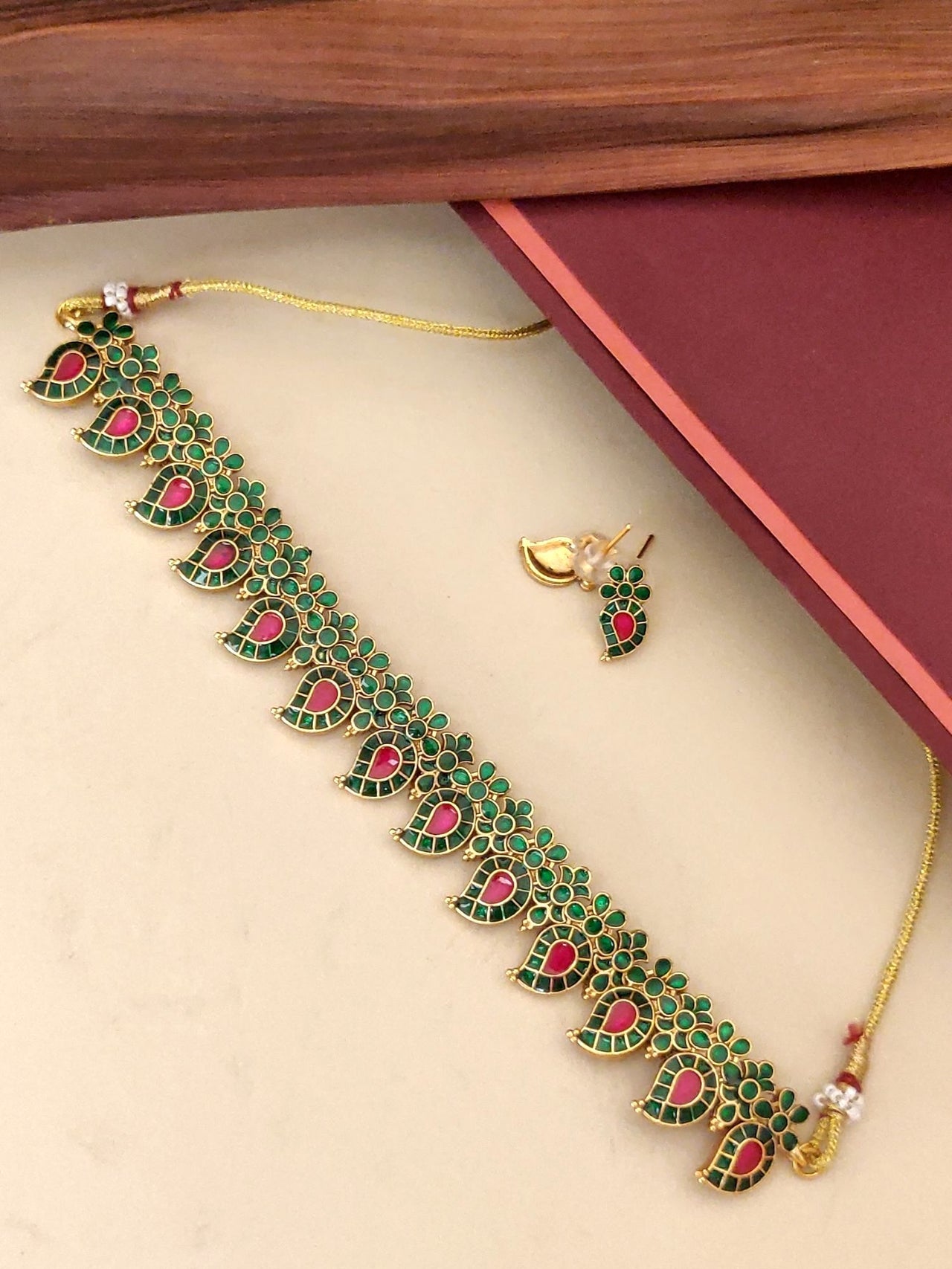 Traditional Kemp stone jewelry necklace with intricate green and red designs, perfect for festive wear