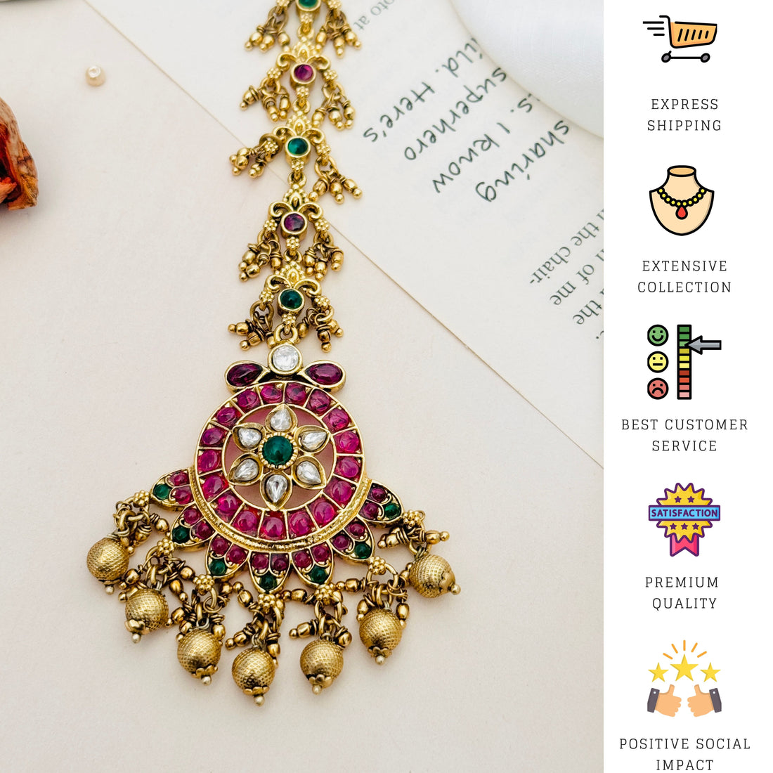 Traditional Matt Gold Plated Temple Maangtikka adorned with red and green stones worn on forehead