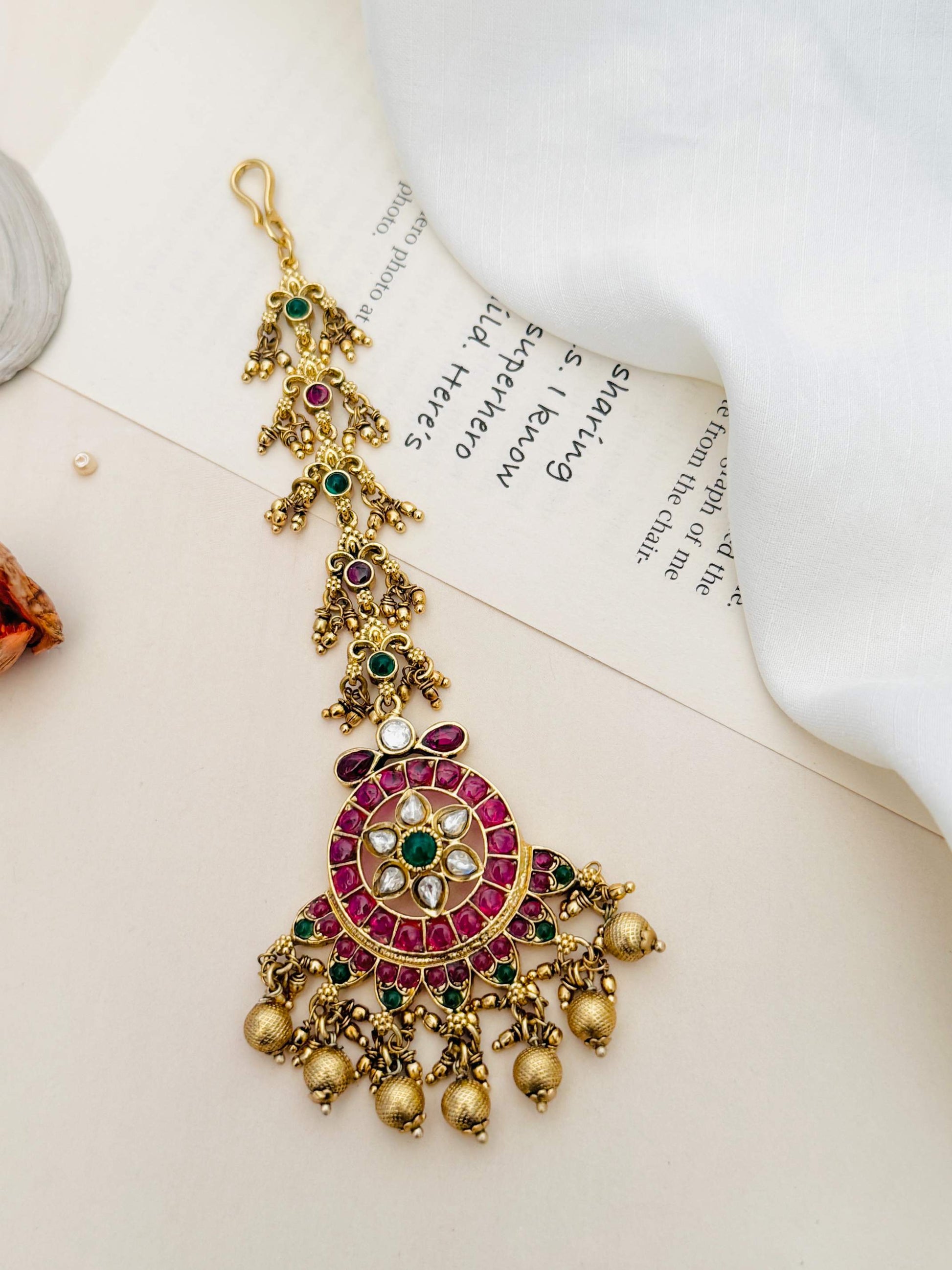 Traditional Matt Gold Plated Temple Maangtikka with pink and green stones and hanging golden beads