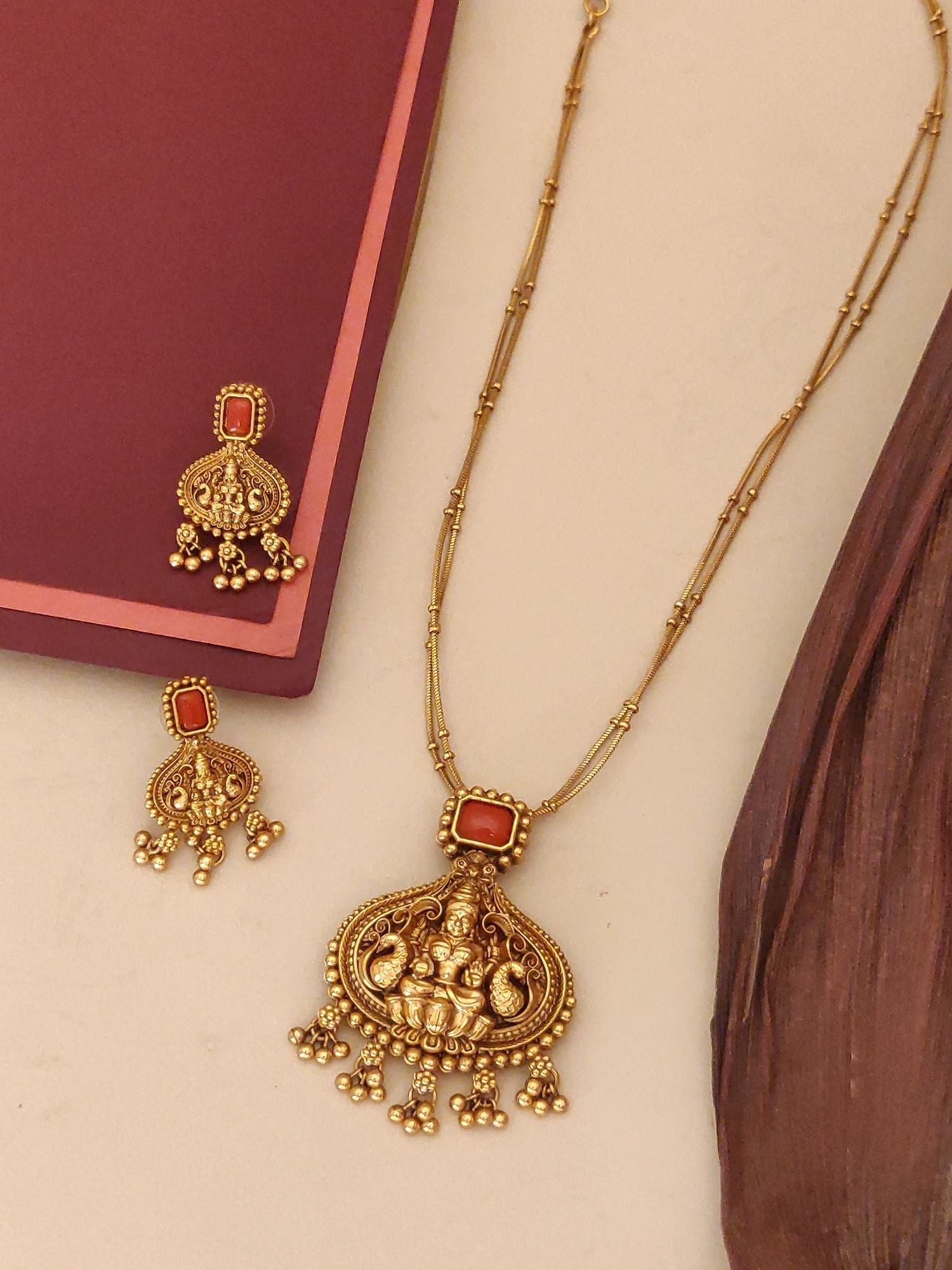 Abdesignsjewellery gold temple style traditional pendant chain necklace with matching jhumka earrings on cream background