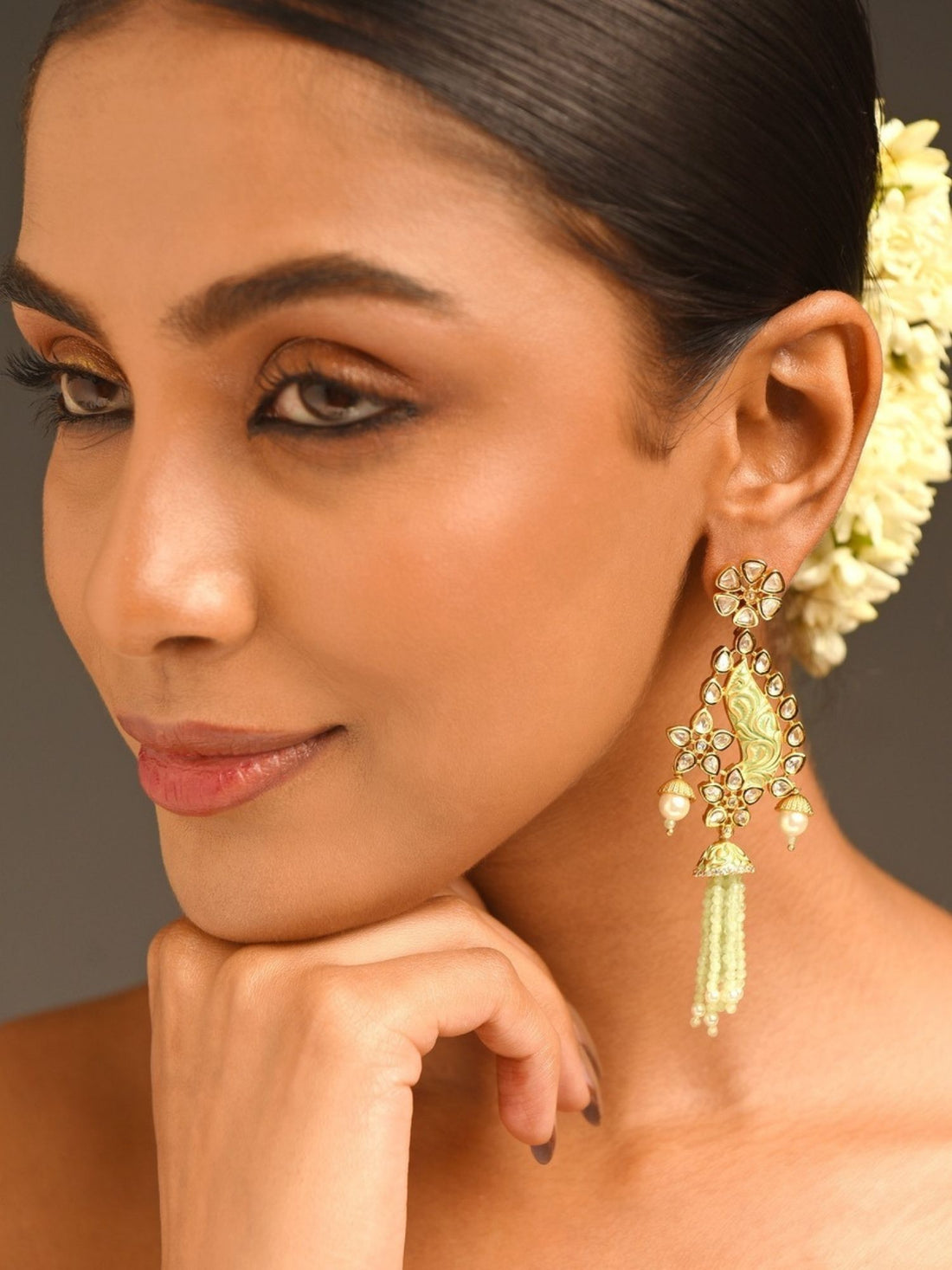 Abdesignsjewellery model wearing Traditonal bridal Kundan earrings gold pearled drop with green tassel