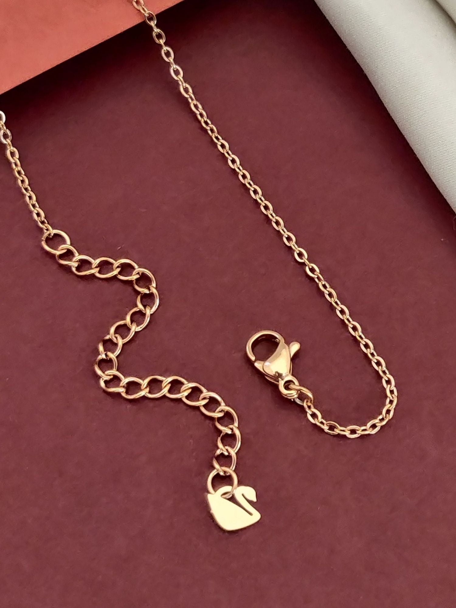 Elegant Twin Black Swan Pendant Necklace on a delicate gold chain for a stylish look
