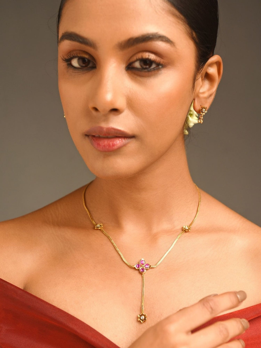 Unique Gold Plated Pendant Set With Earrings featuring delicate floral design on model by Abdesignsjewellery