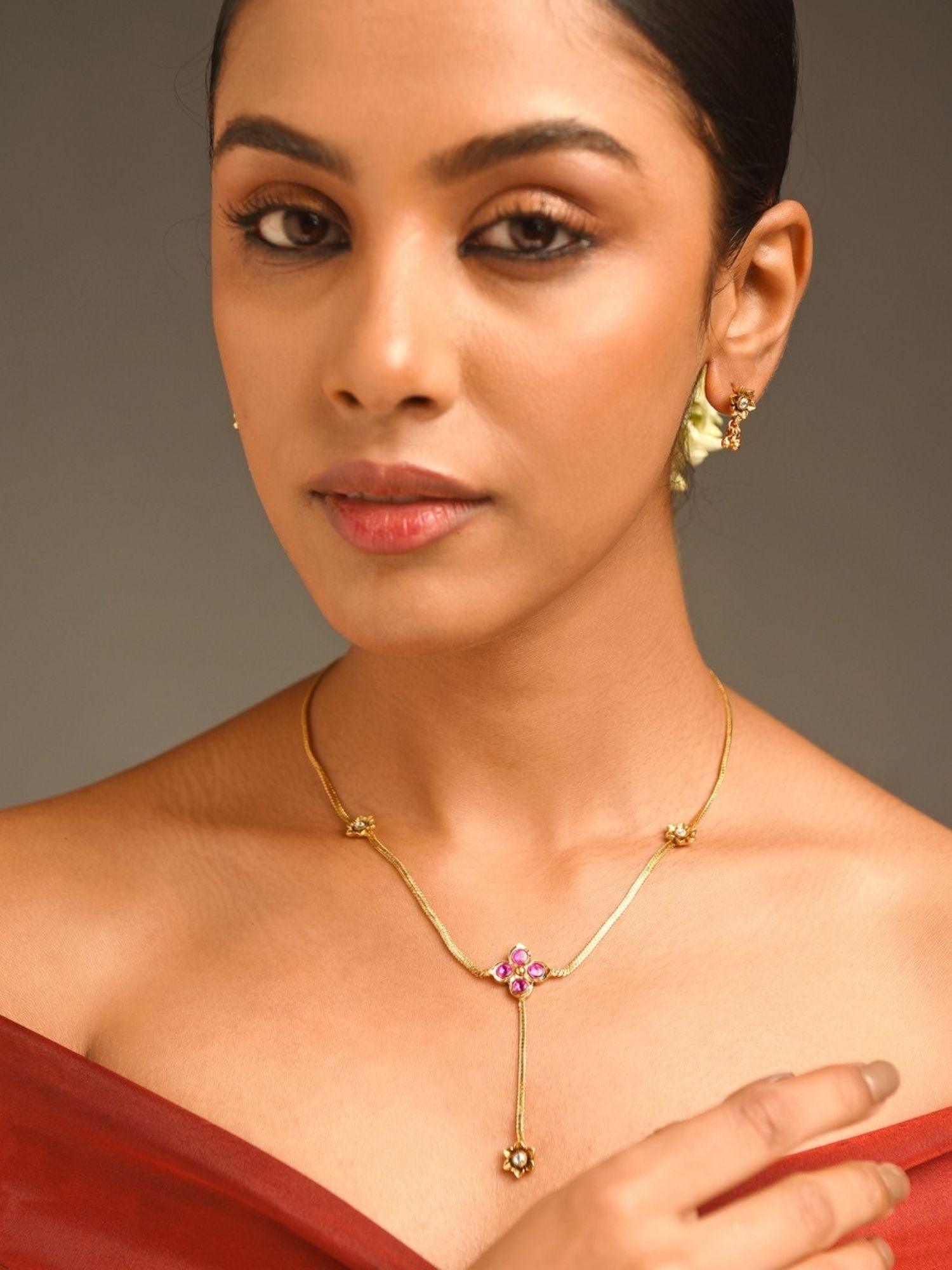 Unique Gold Plated Pendant Set With Earrings featuring delicate floral design on model by Abdesignsjewellery