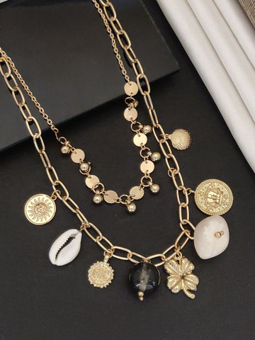 Layered gold western fashion jewelry necklace featuring charms and decorative pendants