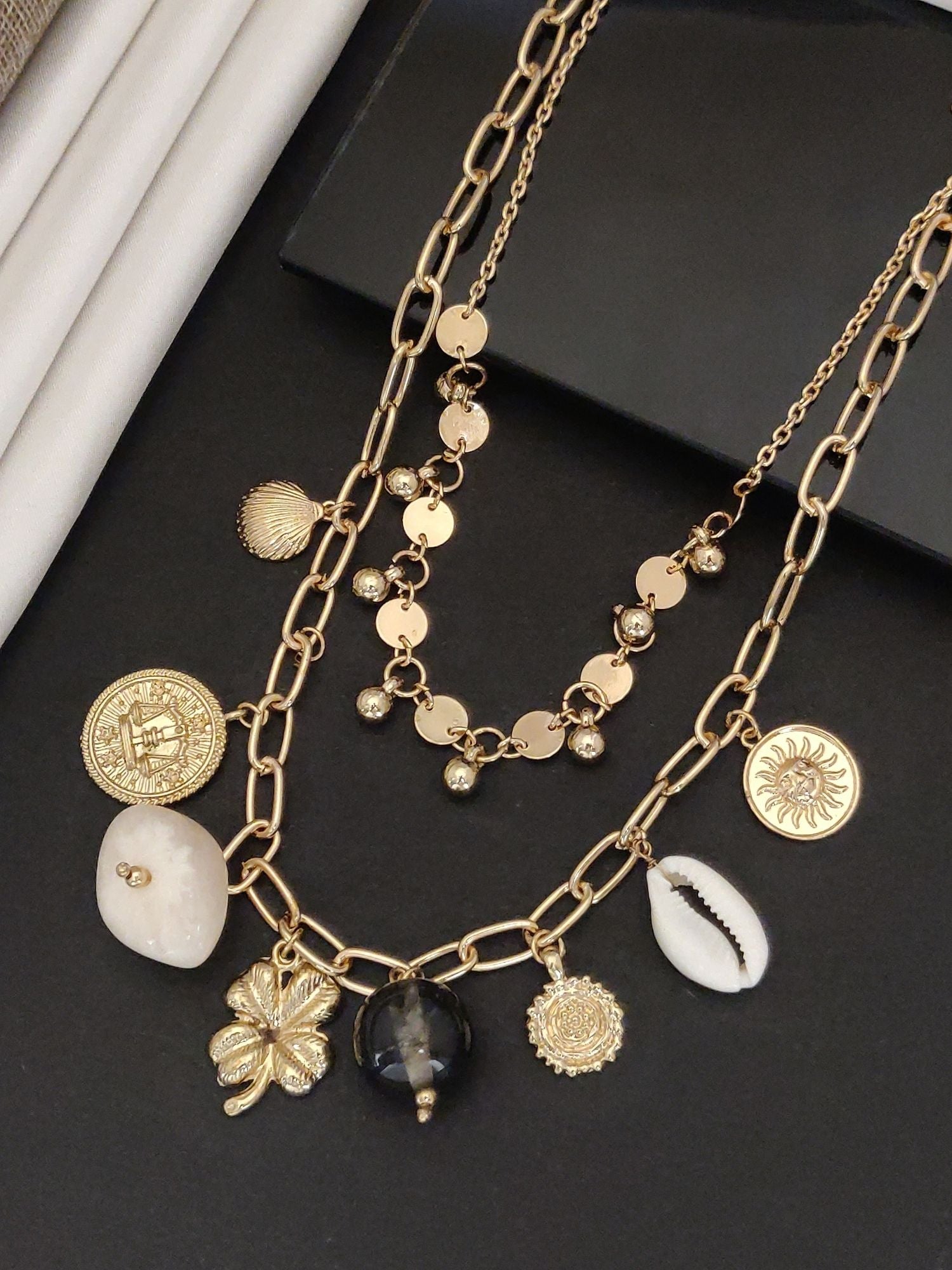 Layered gold pendants chain featuring charms, ideal for western fashion jewelry necklace enthusiasts