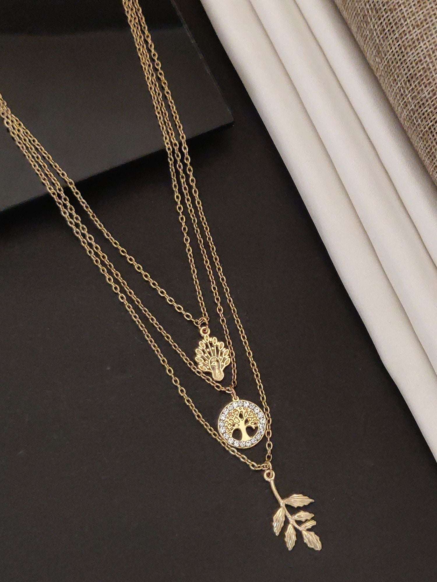 Western wear Gold Plated Layered Necklace featuring elegant leaf and tree designs