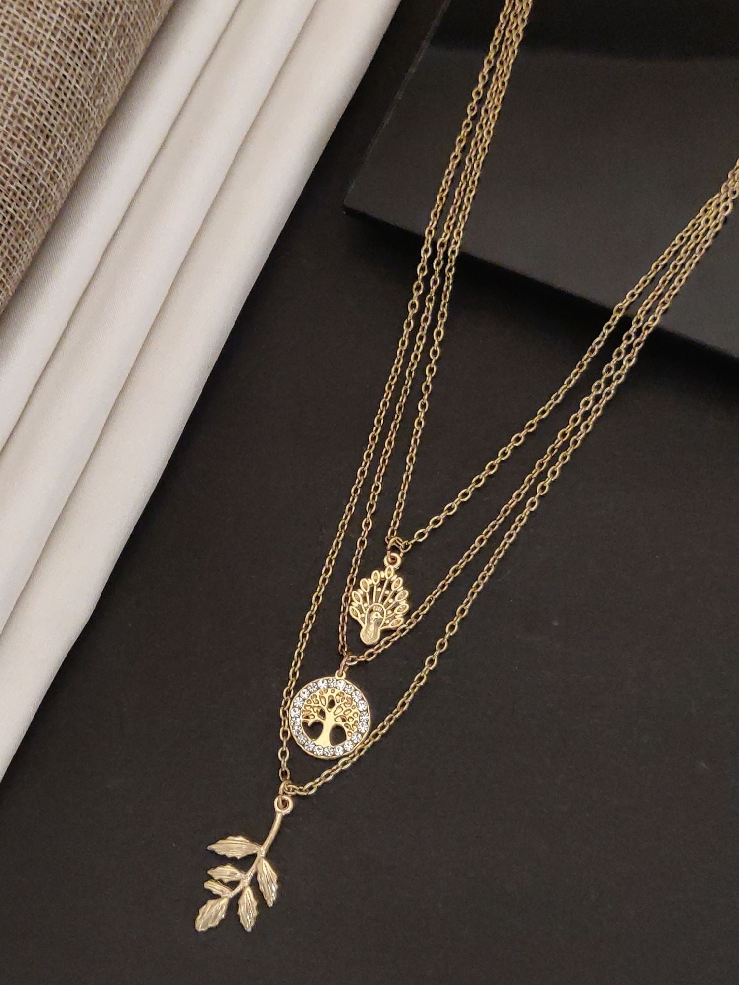 Western wear Gold Plated Layered Necklace with delicate leaf and peace symbol charm