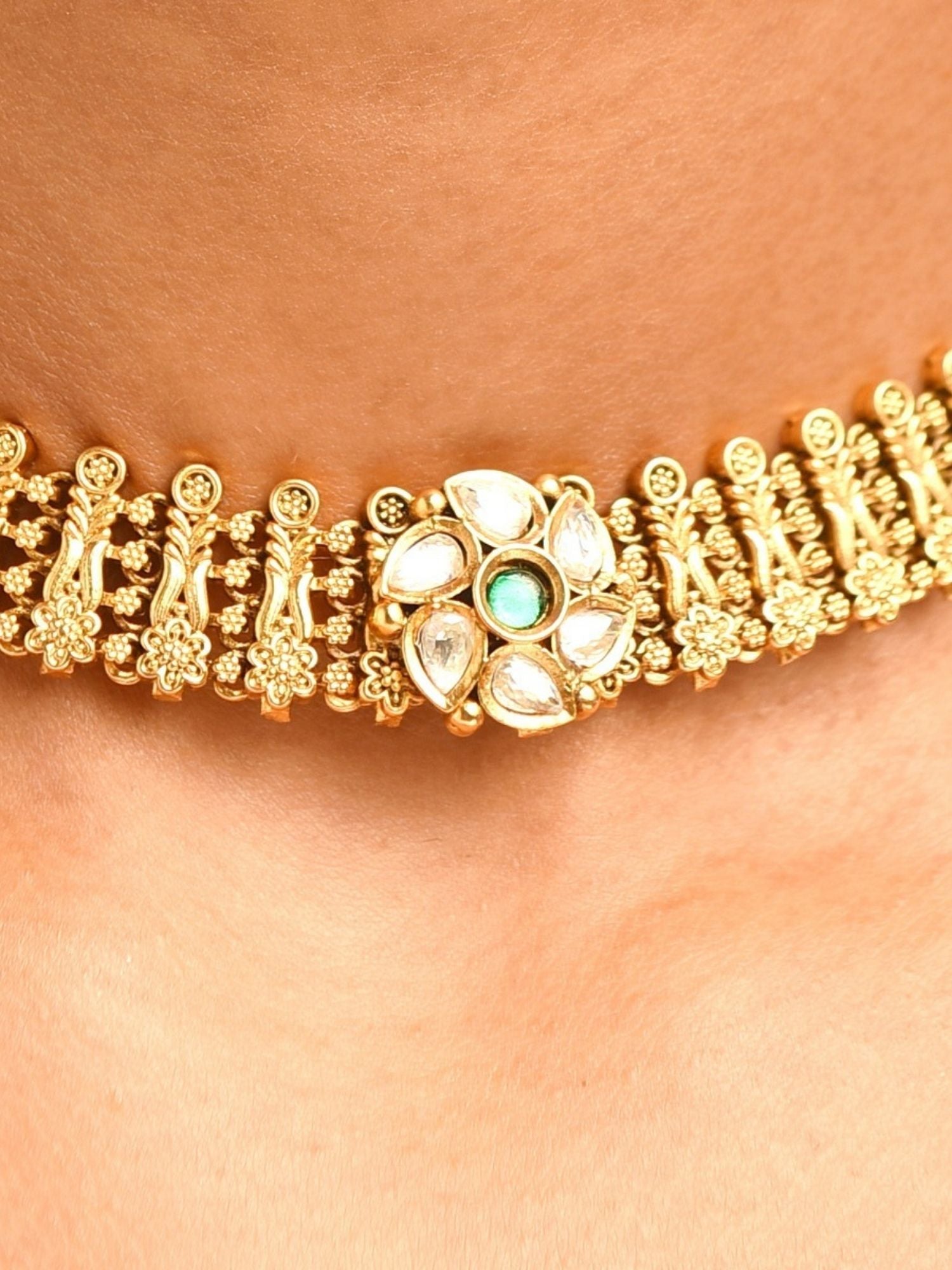 Abdesignsjewellery premium designer choker necklace India gold kundan style with floral white stone and green center on neck