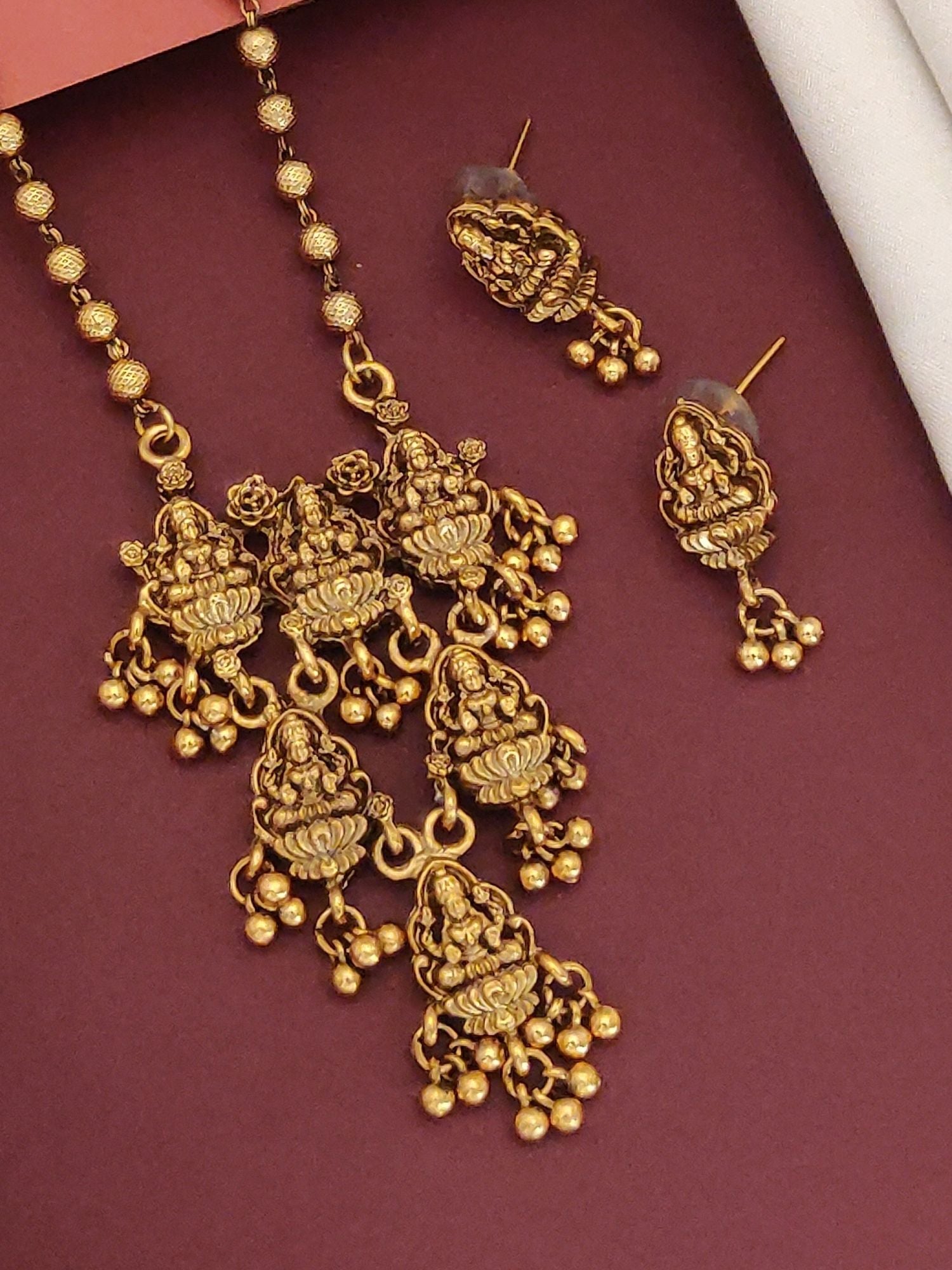 Antique Long Gold Plated Temple Necklace Set ornate carved goddess pendant with jhumka drops and matching earrings