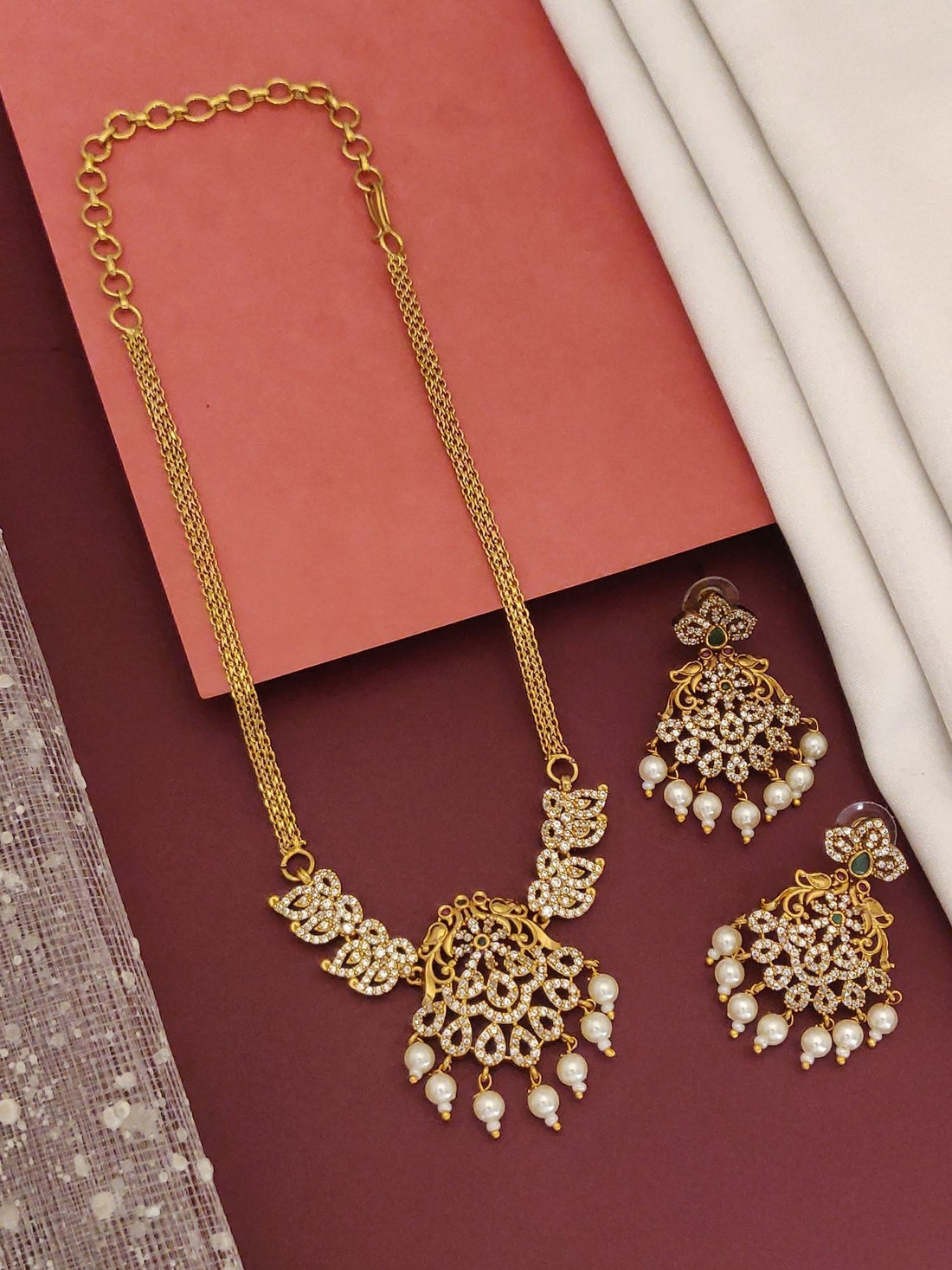 Mesmerising Gold plated American diamond necklace Set ornate gold pendant with pearl drops and matching earrings