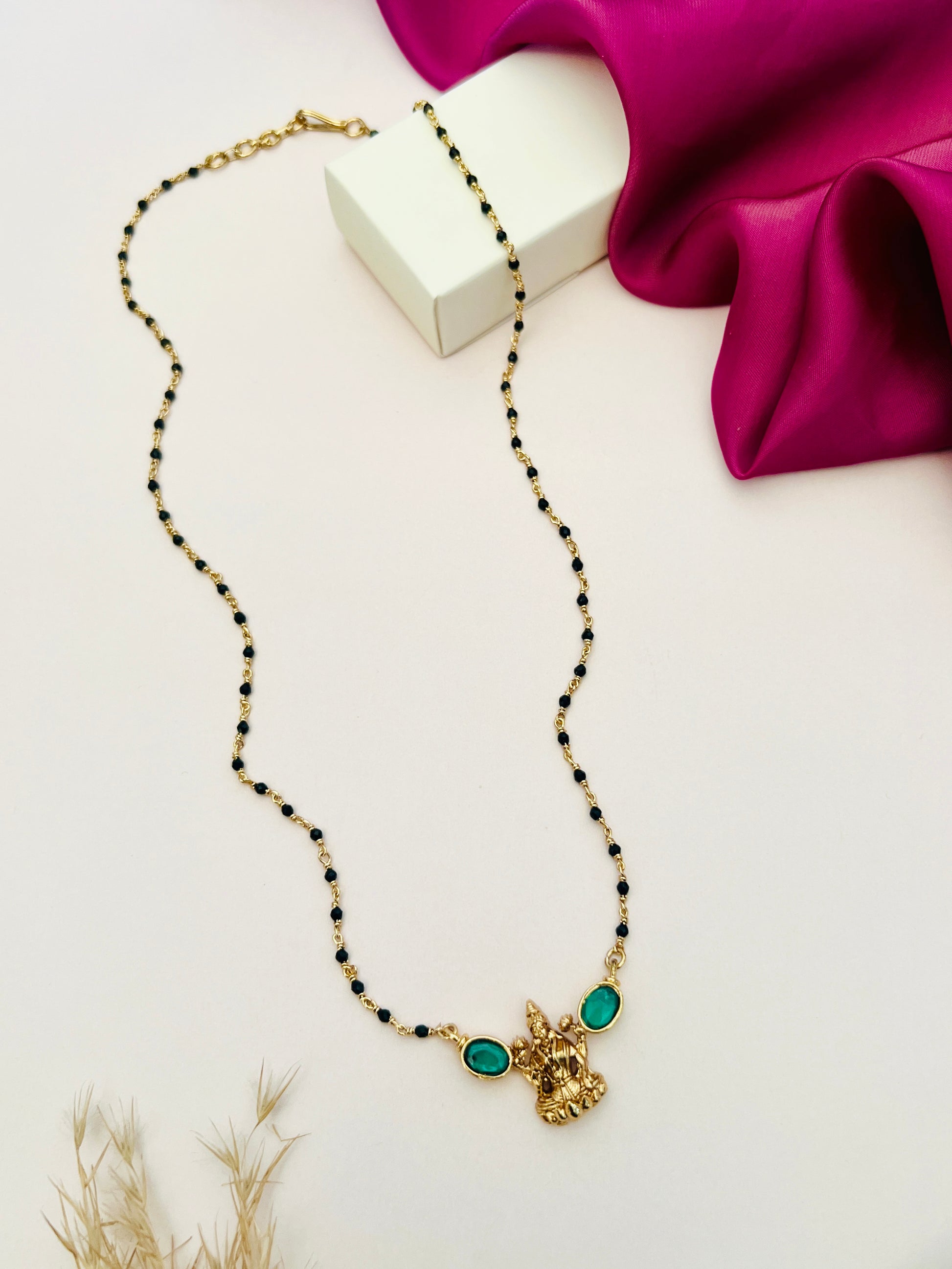 Laxmi Matt Antique Gold Plated Mangalsutra by Abdesignsjewellery with traditional black beads and green stone pendant