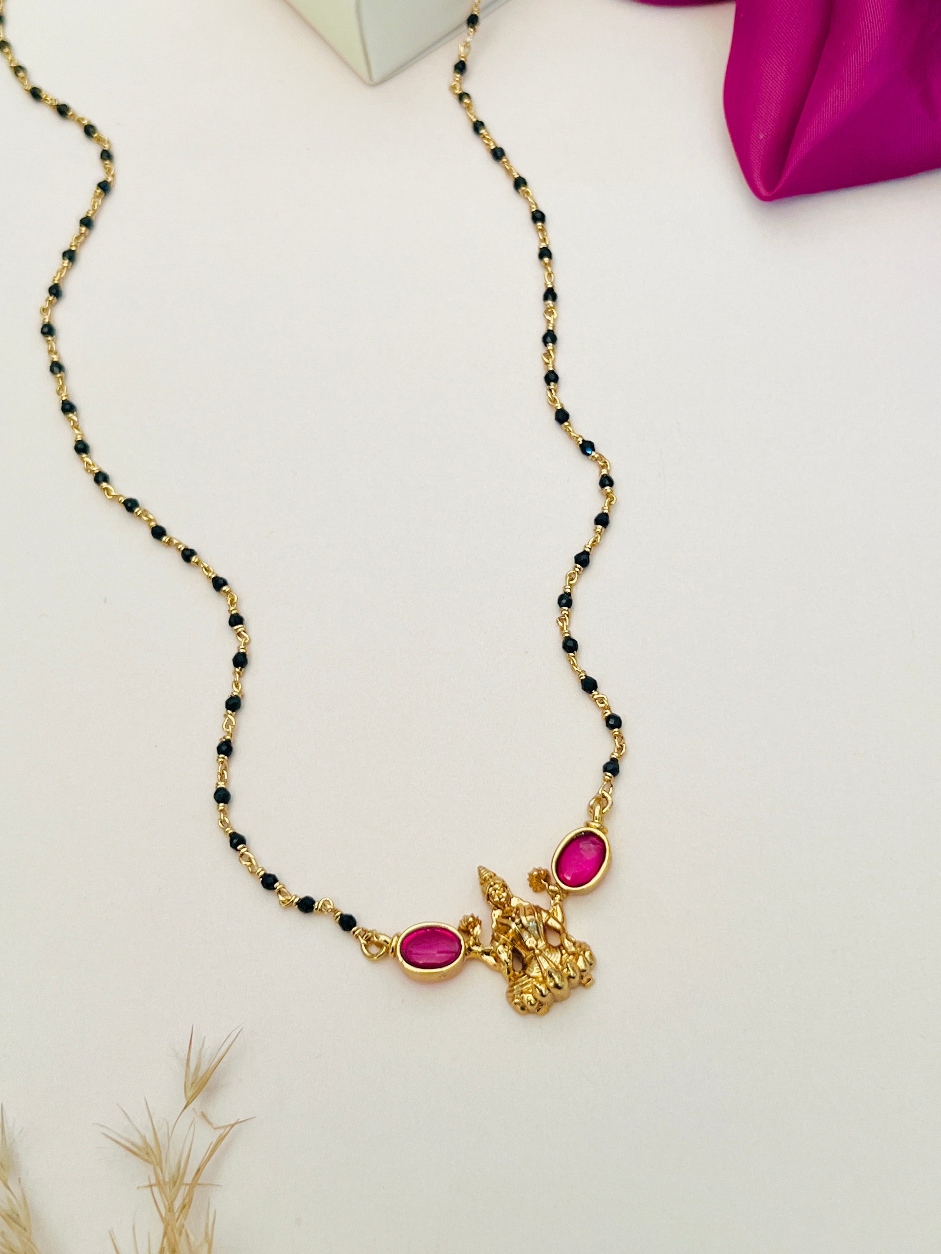 Laxmi Matt Antique Gold Plated Mangalsutra with black beads and pink gemstone accents by Abdesignsjewellery