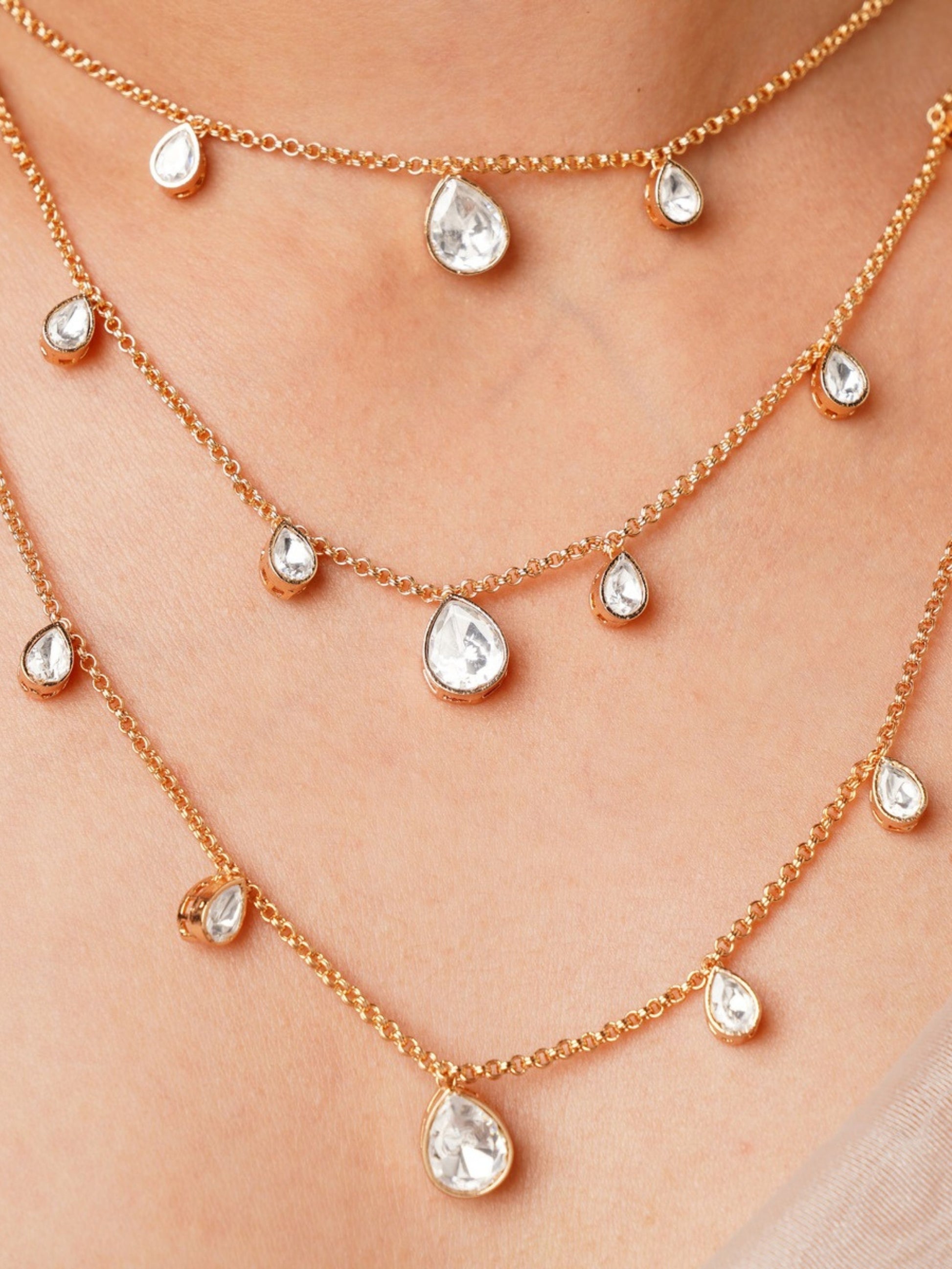 Layered Gold Plated Polki Pendant Chain with multiple teardrop-shaped clear stones on gold chains
