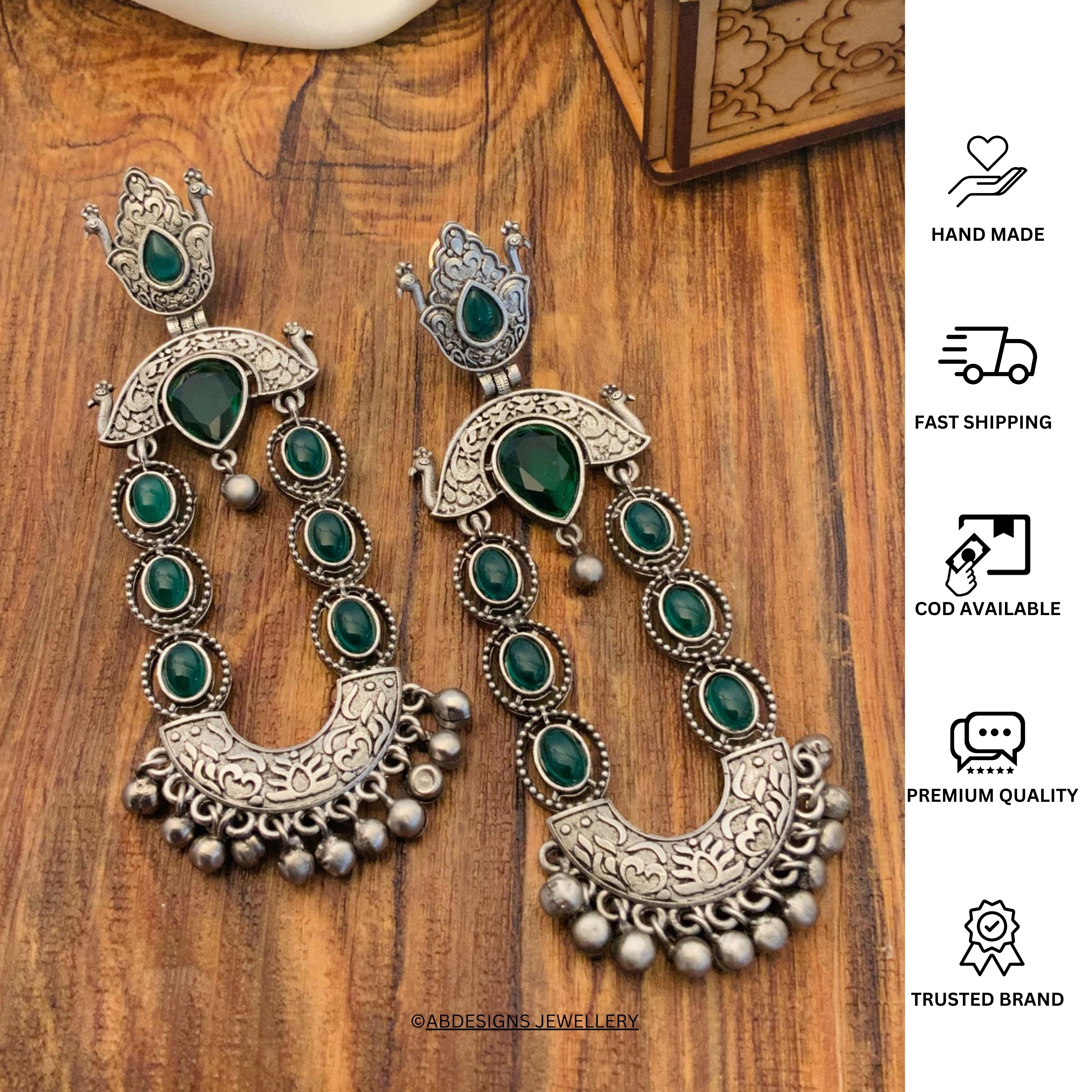 Long Peacock German Silver Earrings by Abdesignsjewellery with green stones and intricate detailing