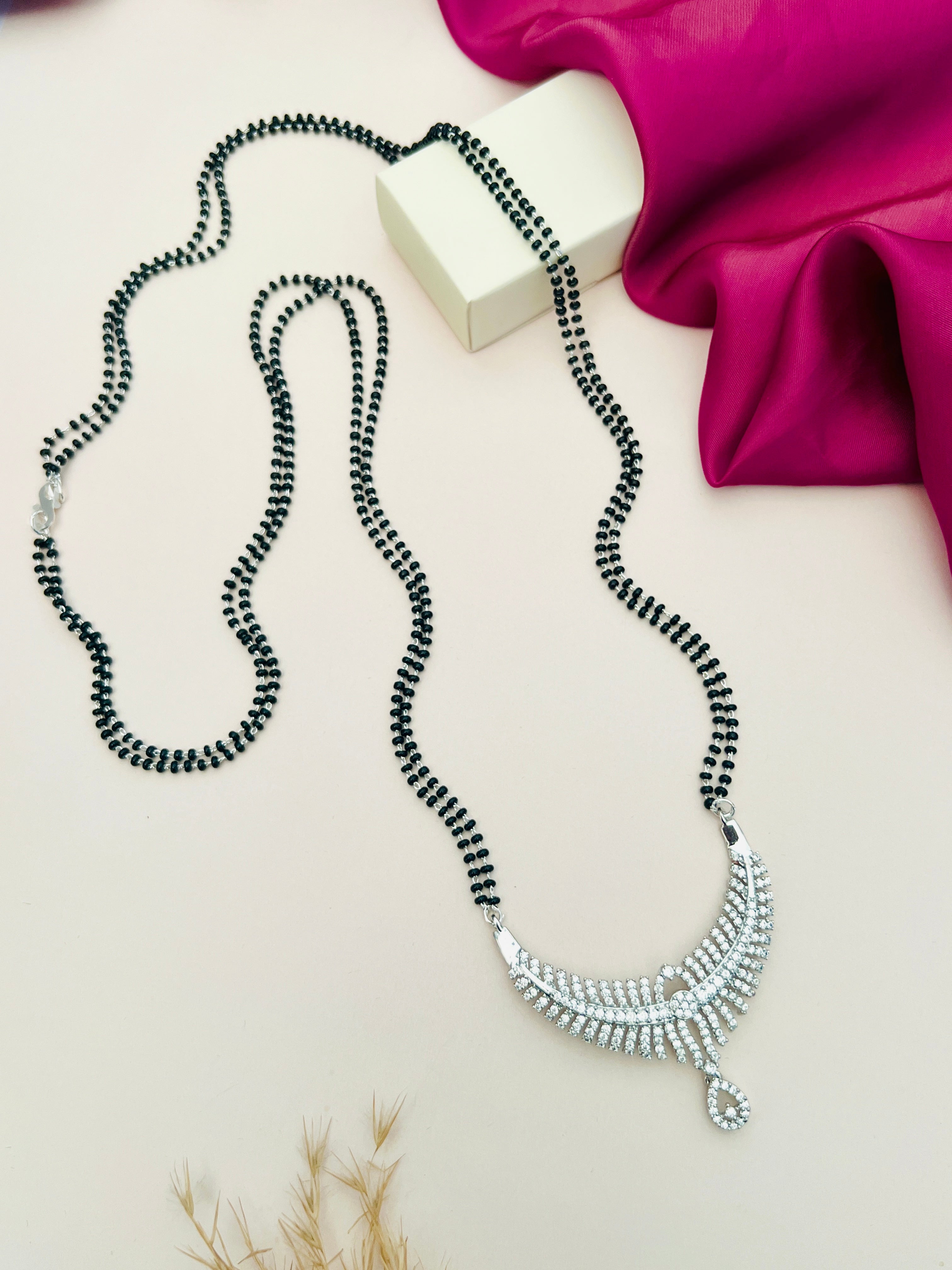 Long Silver Mangalsutra with black beads and intricate silver pendant from Abdesignsjewellery