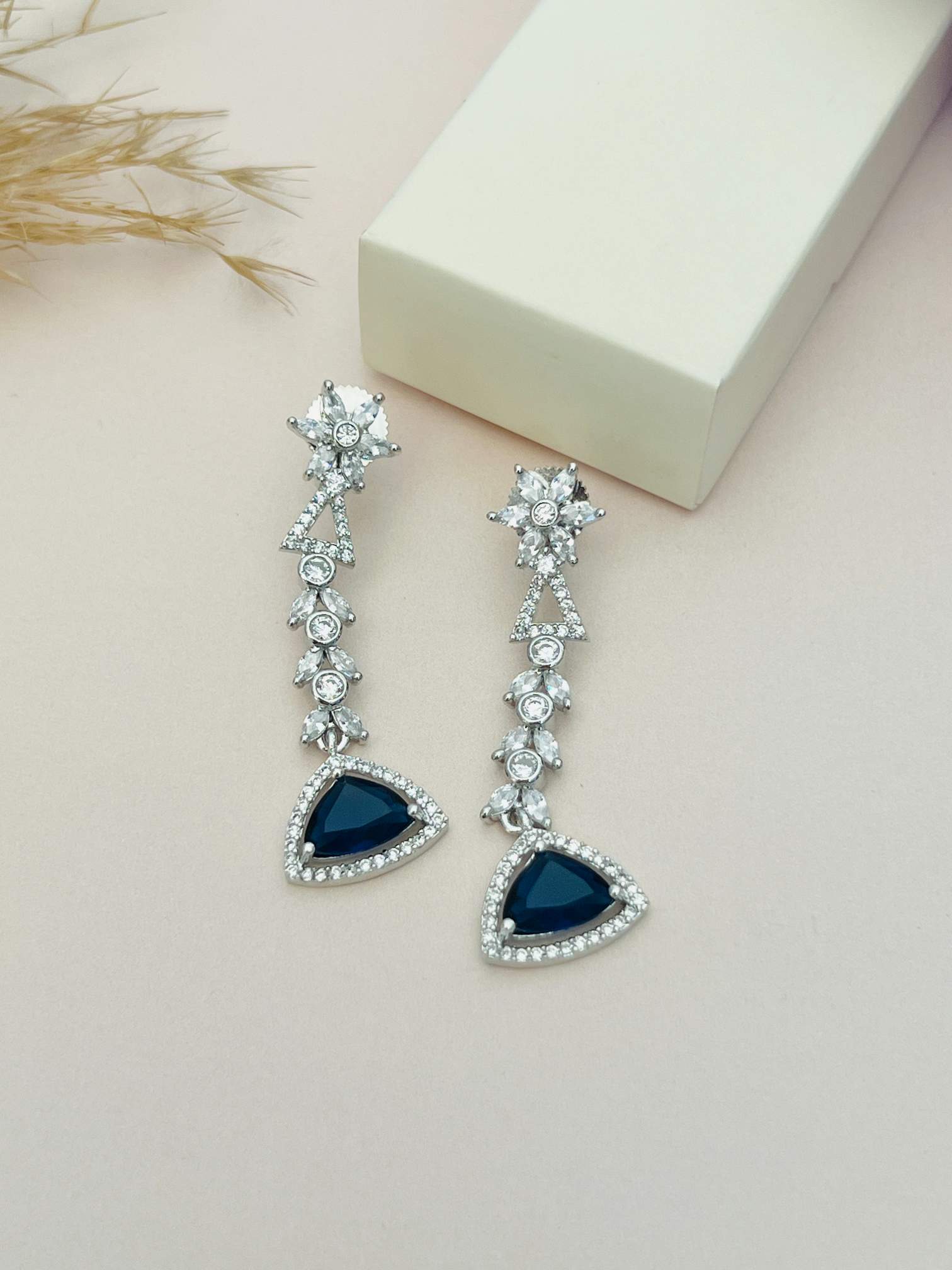 Luxurious Silver Plated American Diamond Necklace earrings with blue gemstone and intricate detailing