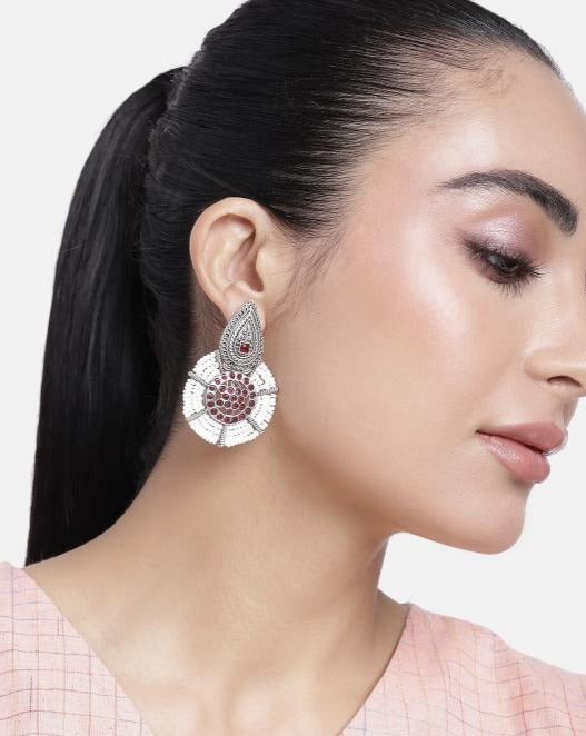 Abdesignsjewellery German Silver Pearl Earring worn by woman with a sleek ponytail and light makeup