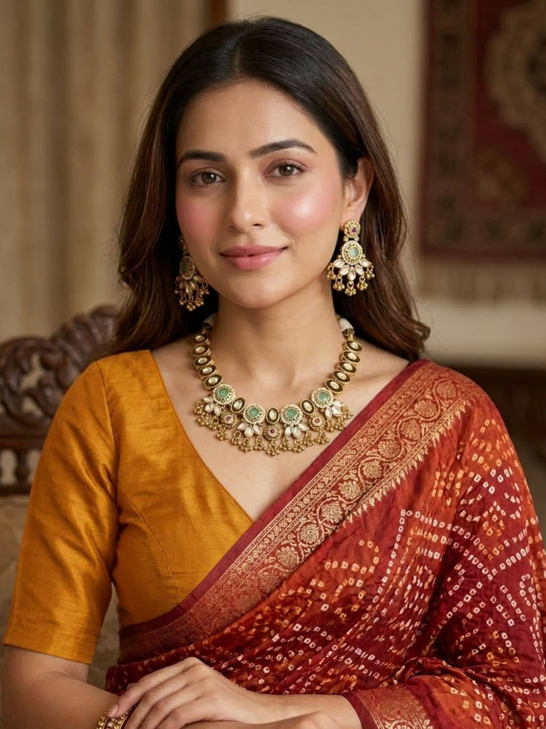 Beautiful necklace for gold featuring intricate detailing, paired with matching earrings and traditional attire