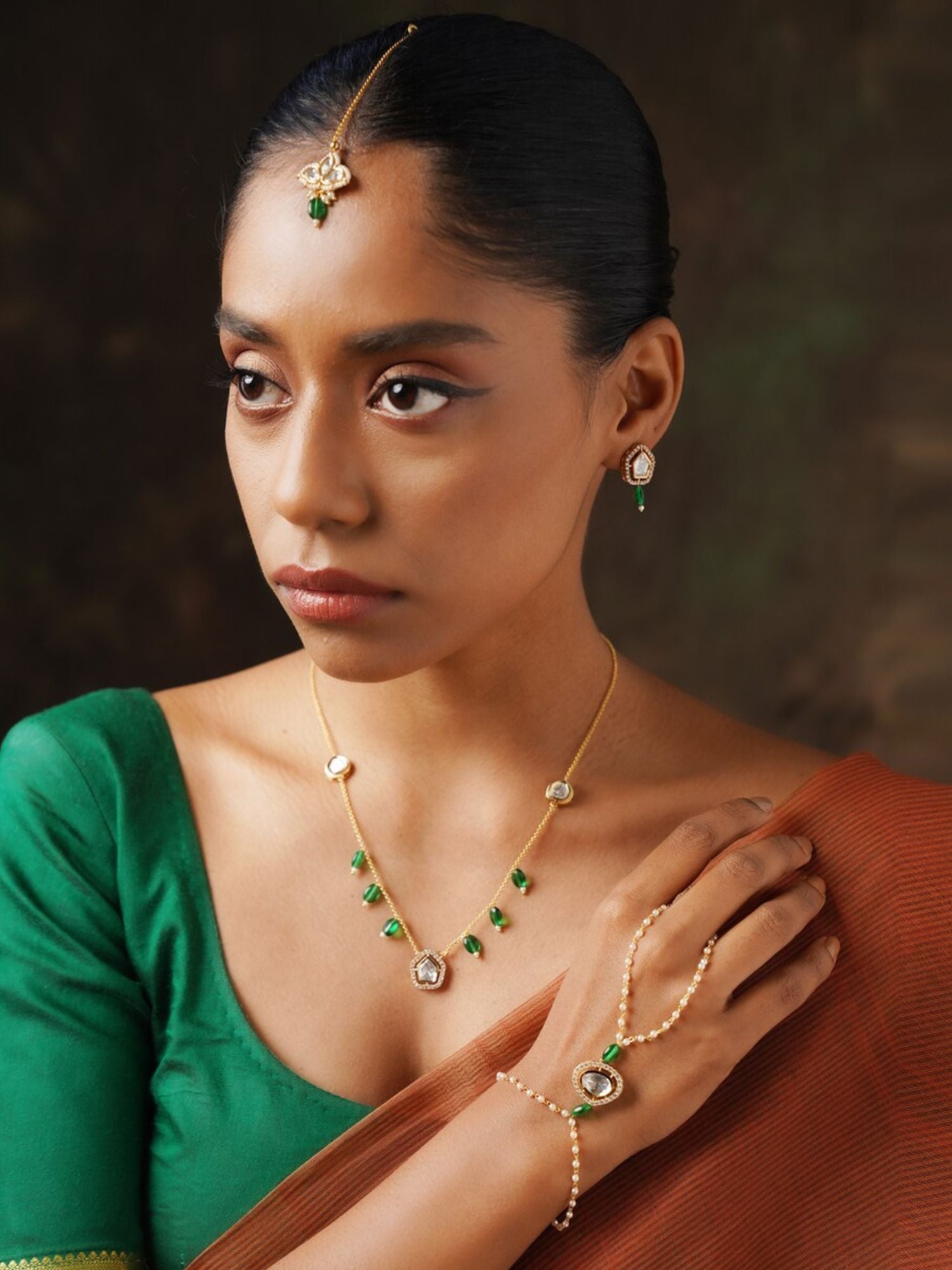 Polki Hand Bracelet Combo on model wearing green blouse and brown saree by Abdesignsjewellery