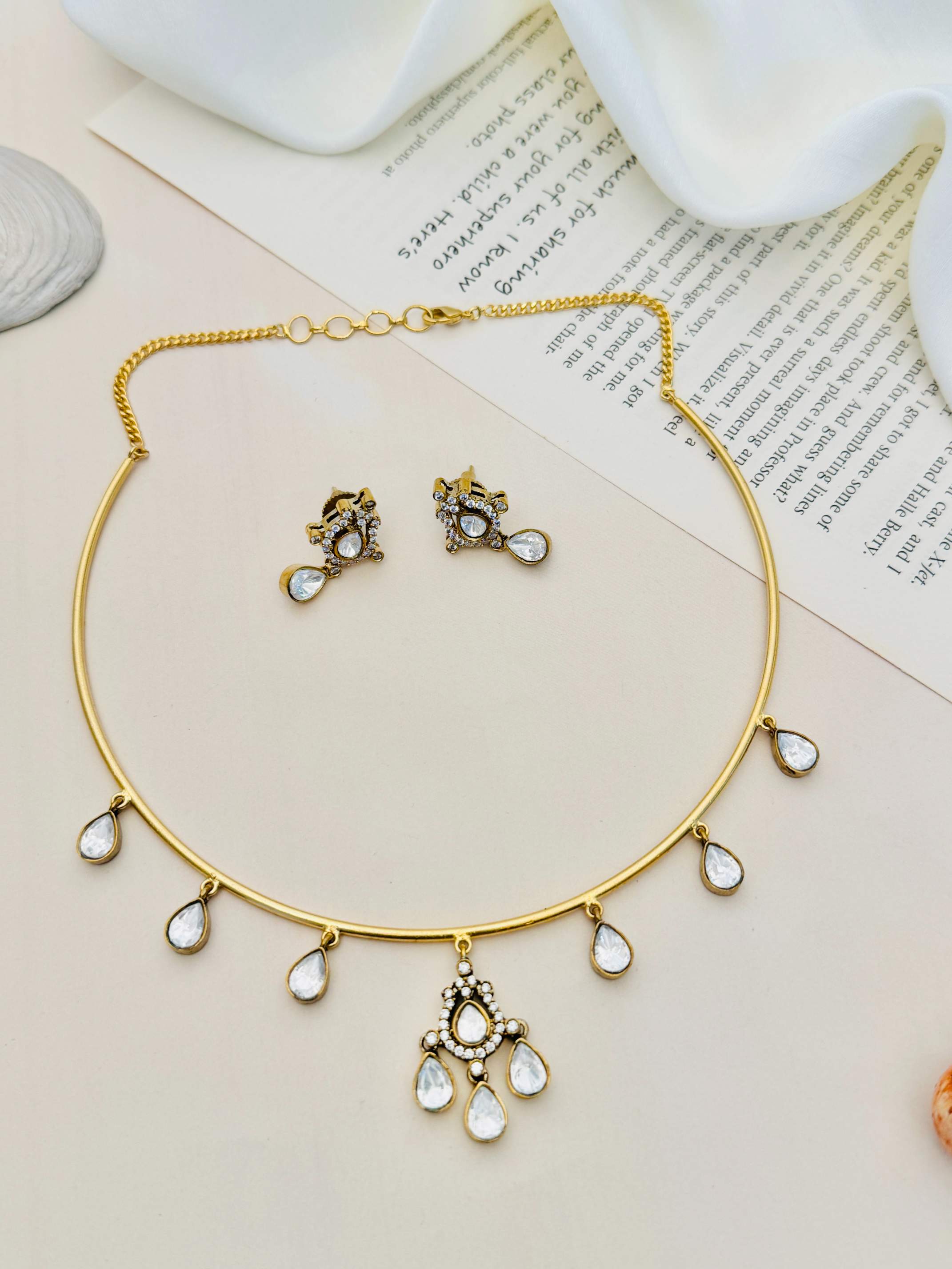 Polki Stone Gold Plated Hasli Necklace Set with teardrop stones and matching earrings by Abdesignsjewellery