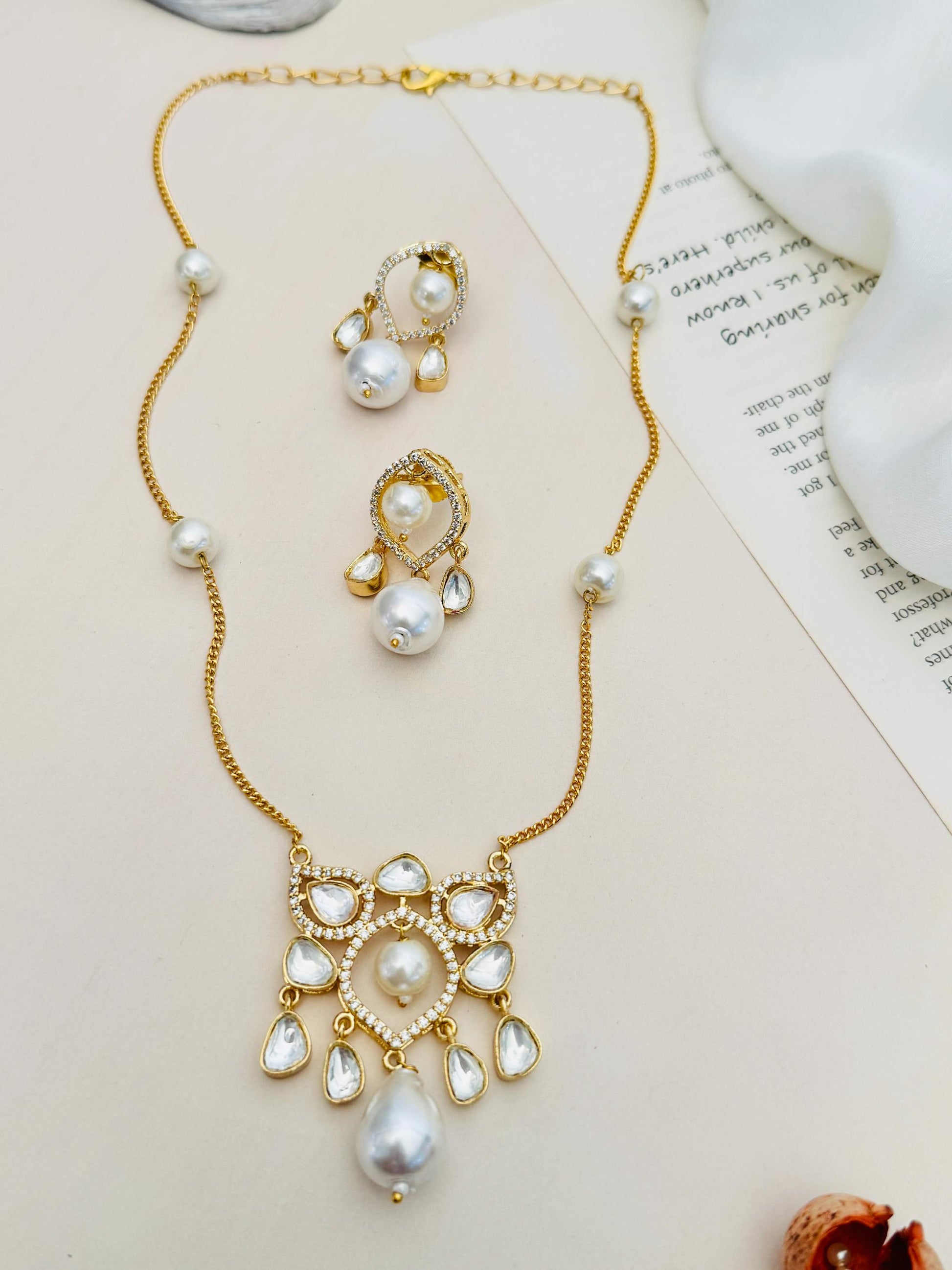 Premium Gold Plated Polki Pendant Set with pearl accents and intricate gold design by Abdesignsjewellery