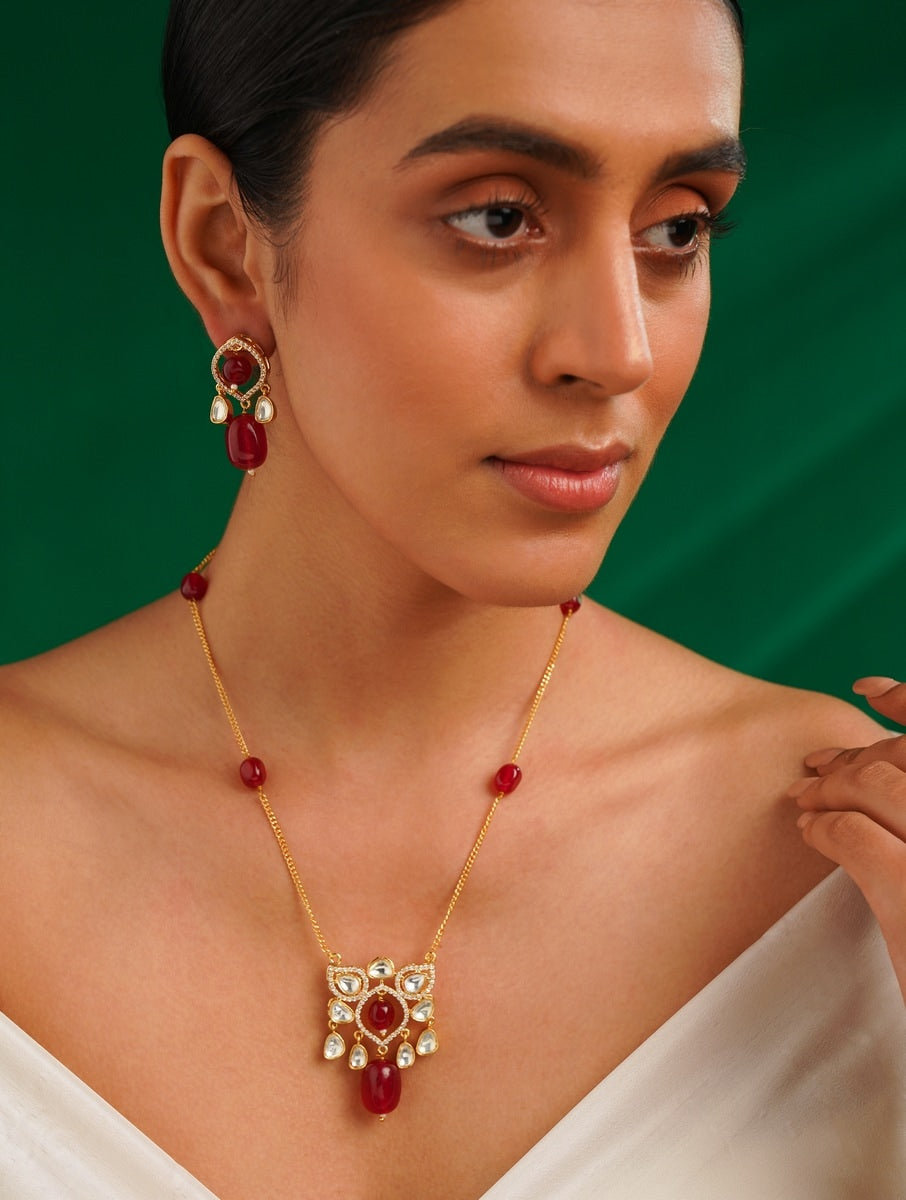 Woman wearing Abdesignsjewellery Premium Gold Plated Polki Pendant Set with red and white stones