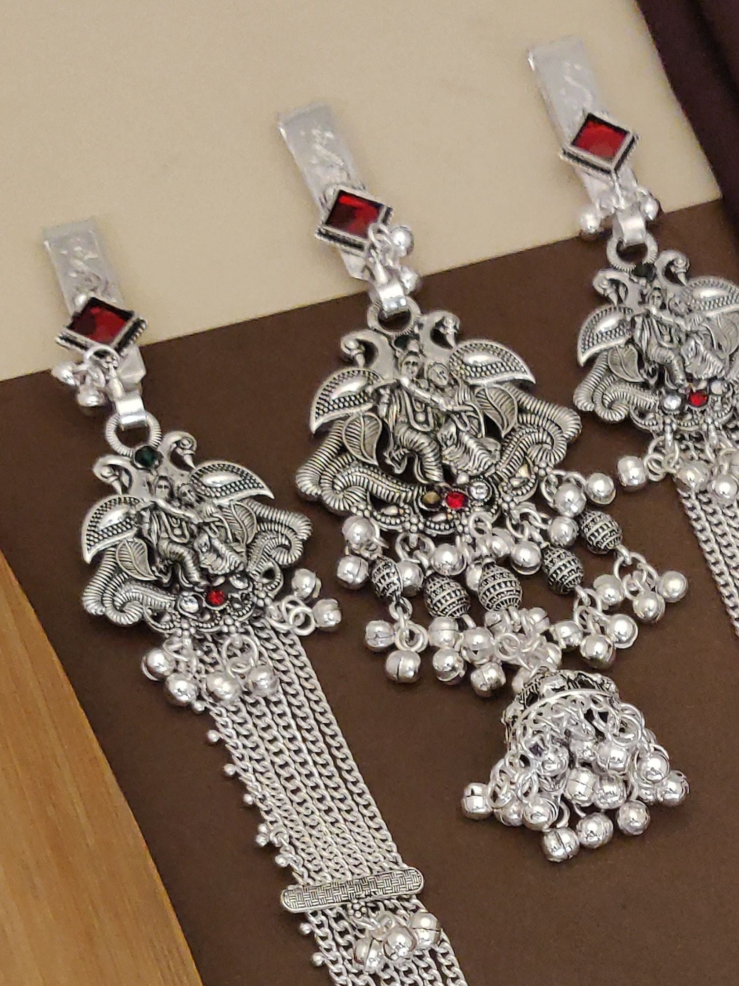 Radha Krishna Style German Silver Plated Long Juda Pin Combo with intricate designs and red embellishments