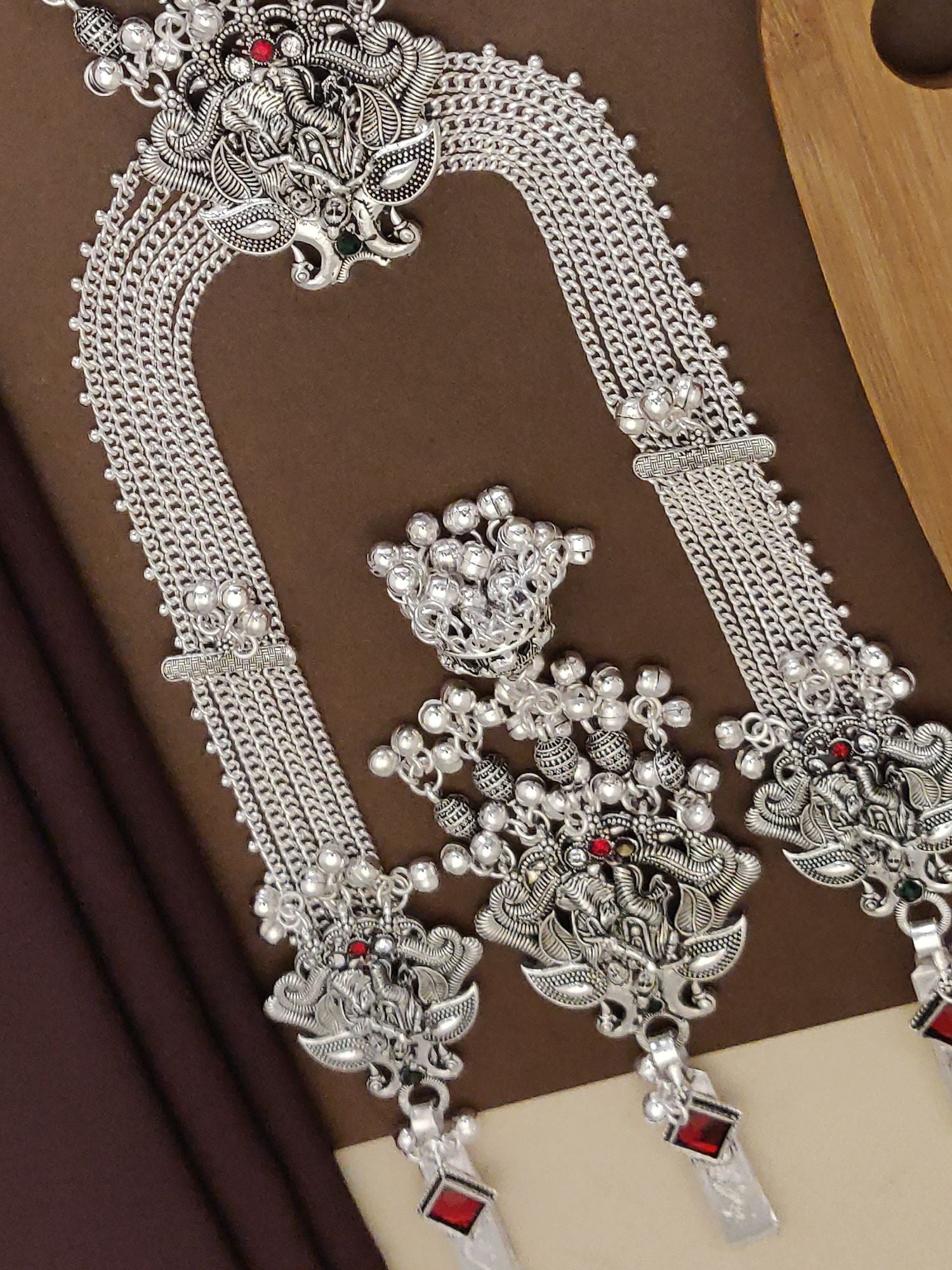 Radha Krishna Style German Silver Plated Long Juda Pin Combo with intricate designs and red accents.