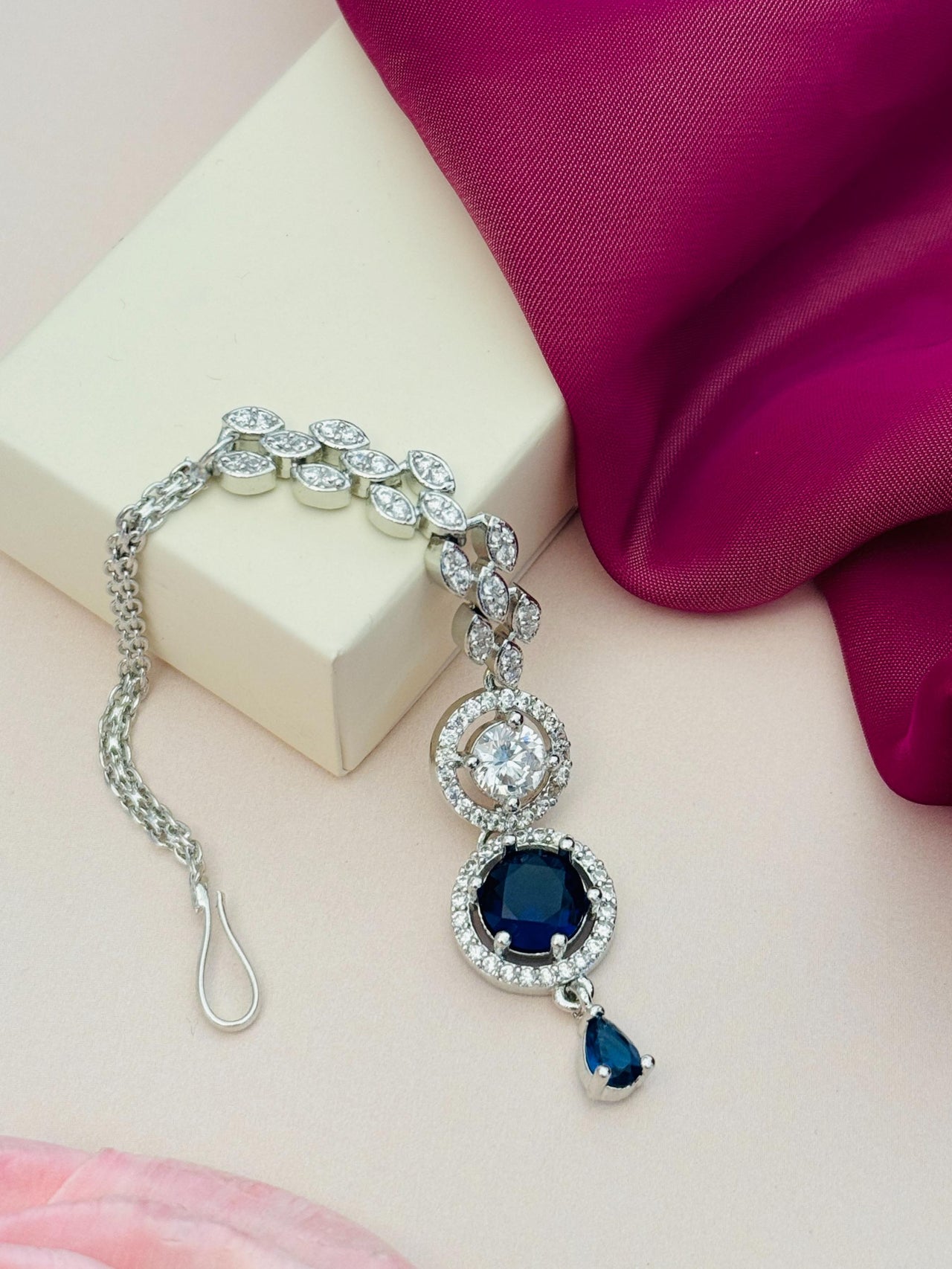 Round Silver Plated American Diamond Maangtikka with blue stones and intricate design by Abdesignsjewellery