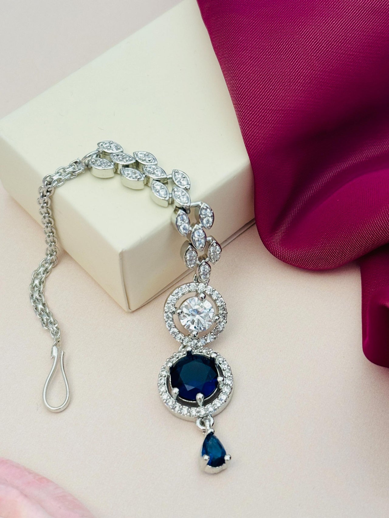 Round Silver Plated American Diamond Maangtikka featuring a blue stone and intricate silver design