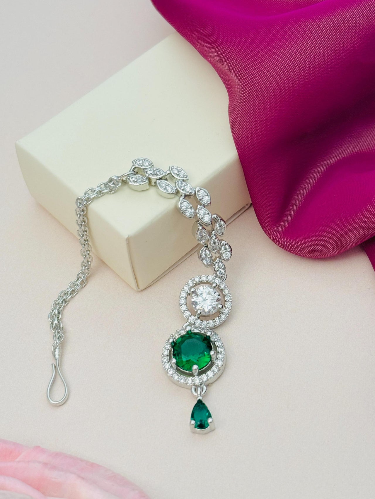 Round Silver Plated American Diamond Maangtikka with green and clear stones from Abdesignsjewellery