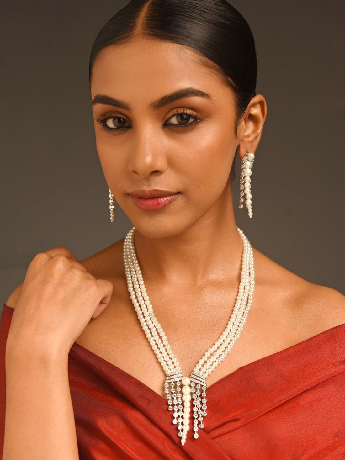 Royal Silver Plated Long Pearl Necklace Set worn by woman with matching pearl earrings