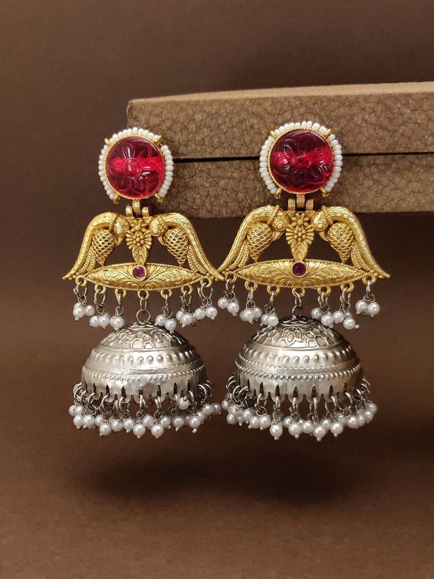 Stunning ruby peacock jhumka earrings with intricate design and silver bell bottoms