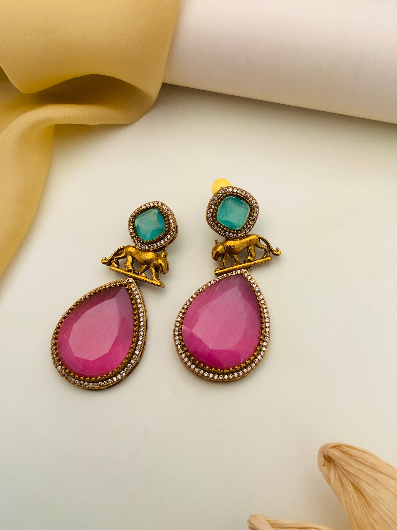Abdesignsjewellery Sabyasachi Earrings with pink teardrop stones, green square gems, and gold elephant details