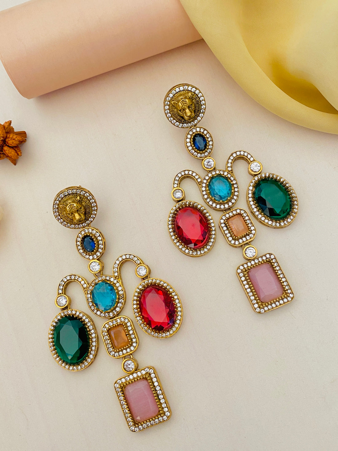 Sabyasachi inspired gold plated earrings by Abdesignsjewellery with colorful gemstones and intricate detailing