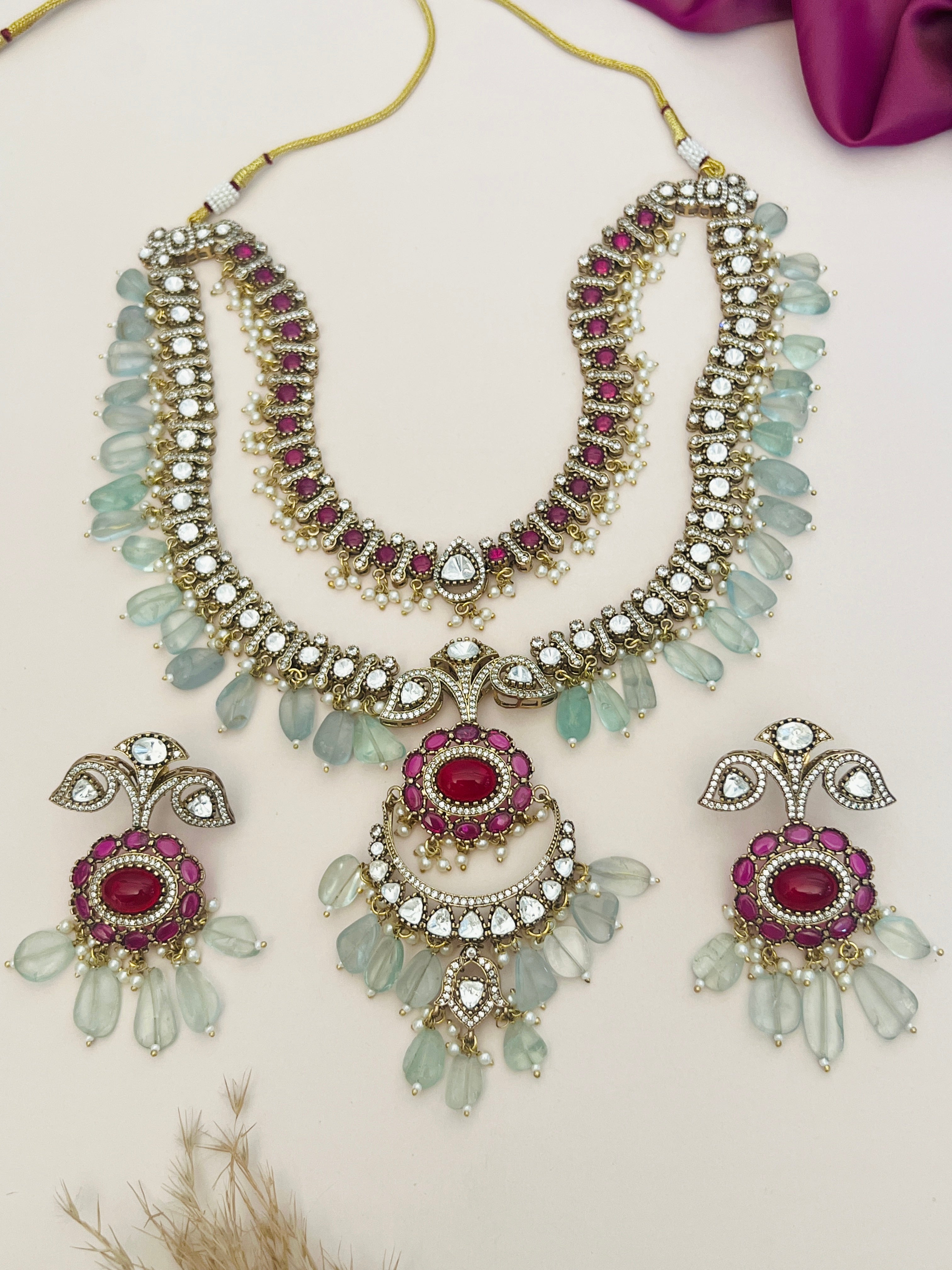 Sabyasachi Inspired Ruby Emerald Multilayer Necklace Set by Abdesignsjewellery with intricate detailing and matching earrings