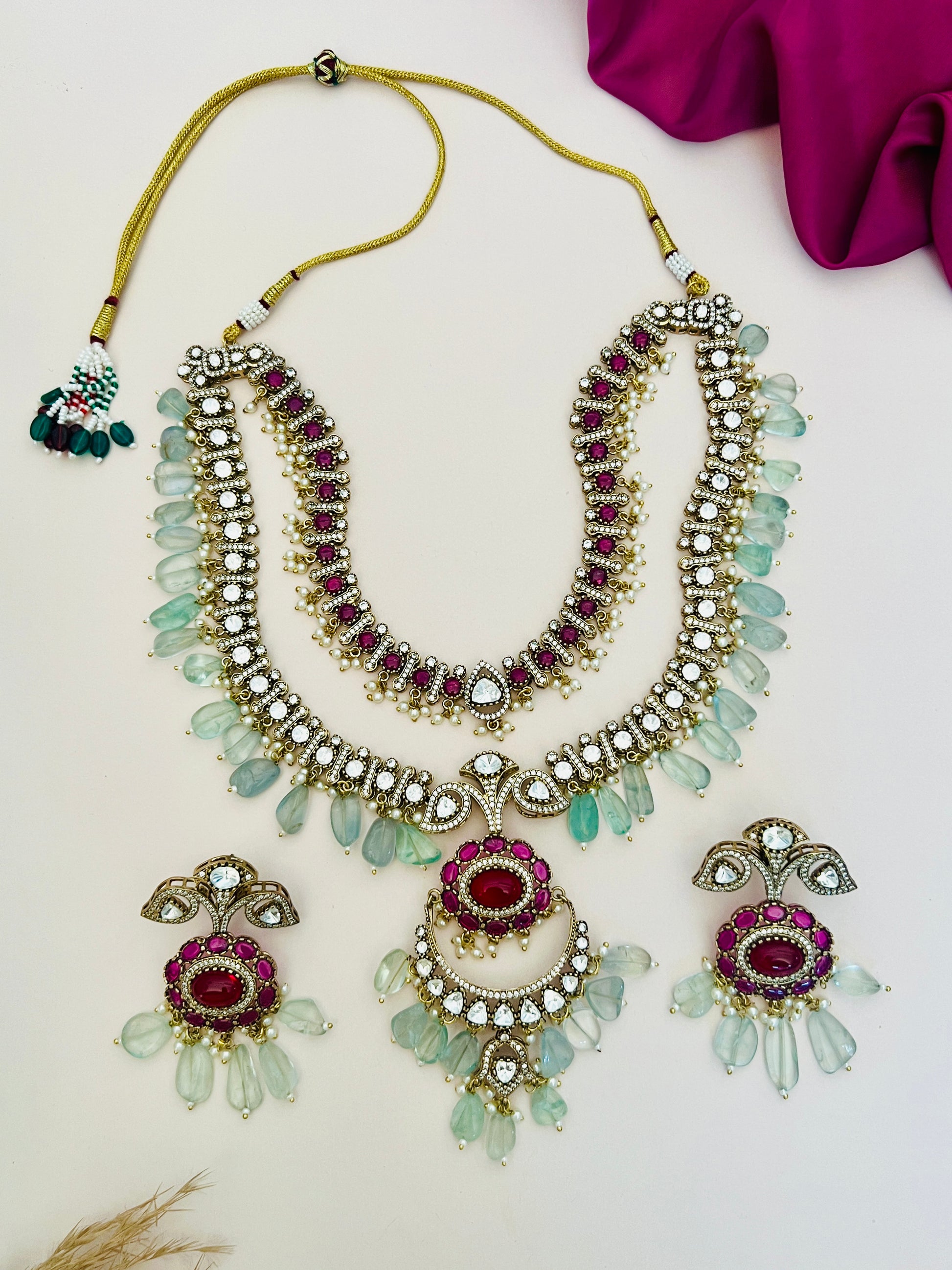 Sabyasachi Inspired Ruby Emerald Multilayer Necklace Set with intricate ruby and emerald stones by Abdesignsjewellery