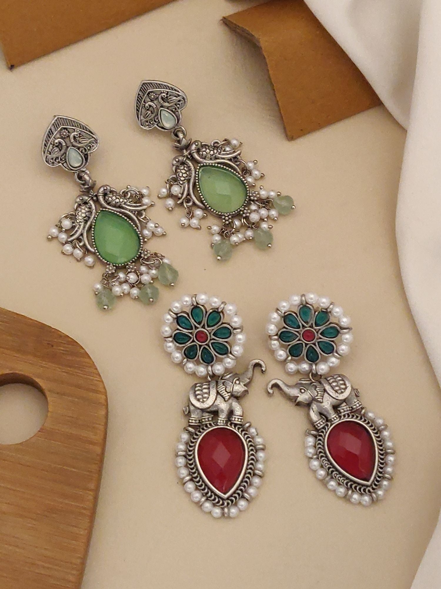 Set Of 2 German Silver Earring Combo featuring intricate designs with colorful stones and pearl accents