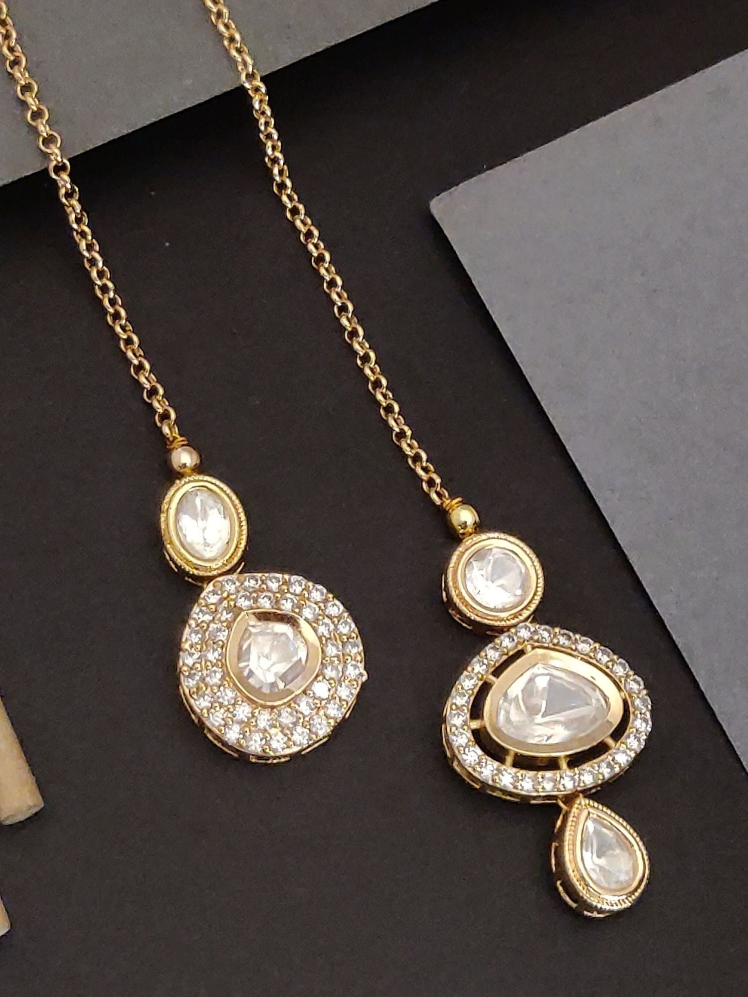 Set of 2 Gold Plated Polki Maangtikka Combo featuring intricate designs and shimmering stones