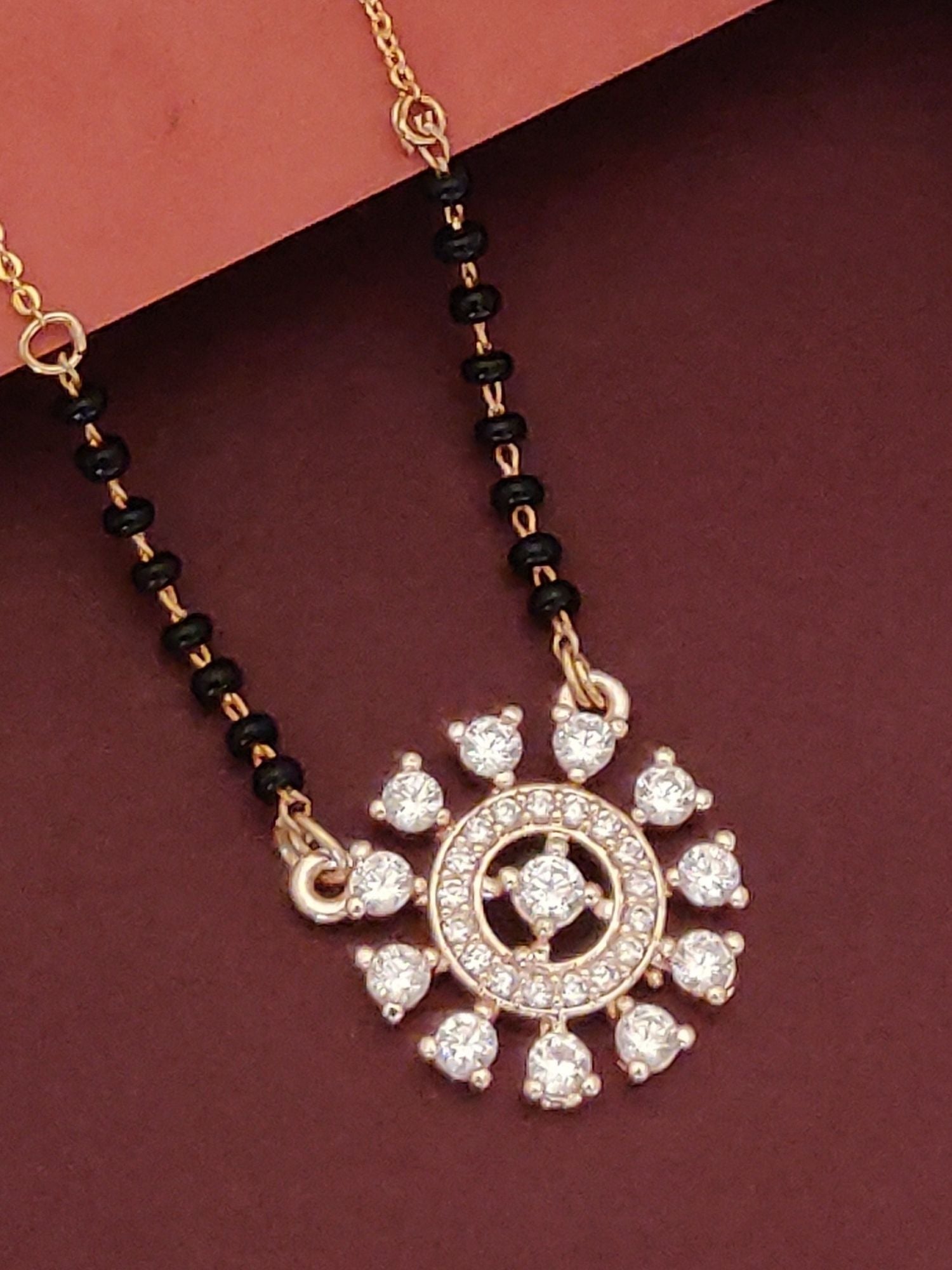 Abdesignsjewellery mangalsutra with black beads and gold floral pendant studded with crystals buy glamorous mangalsutra jewelry