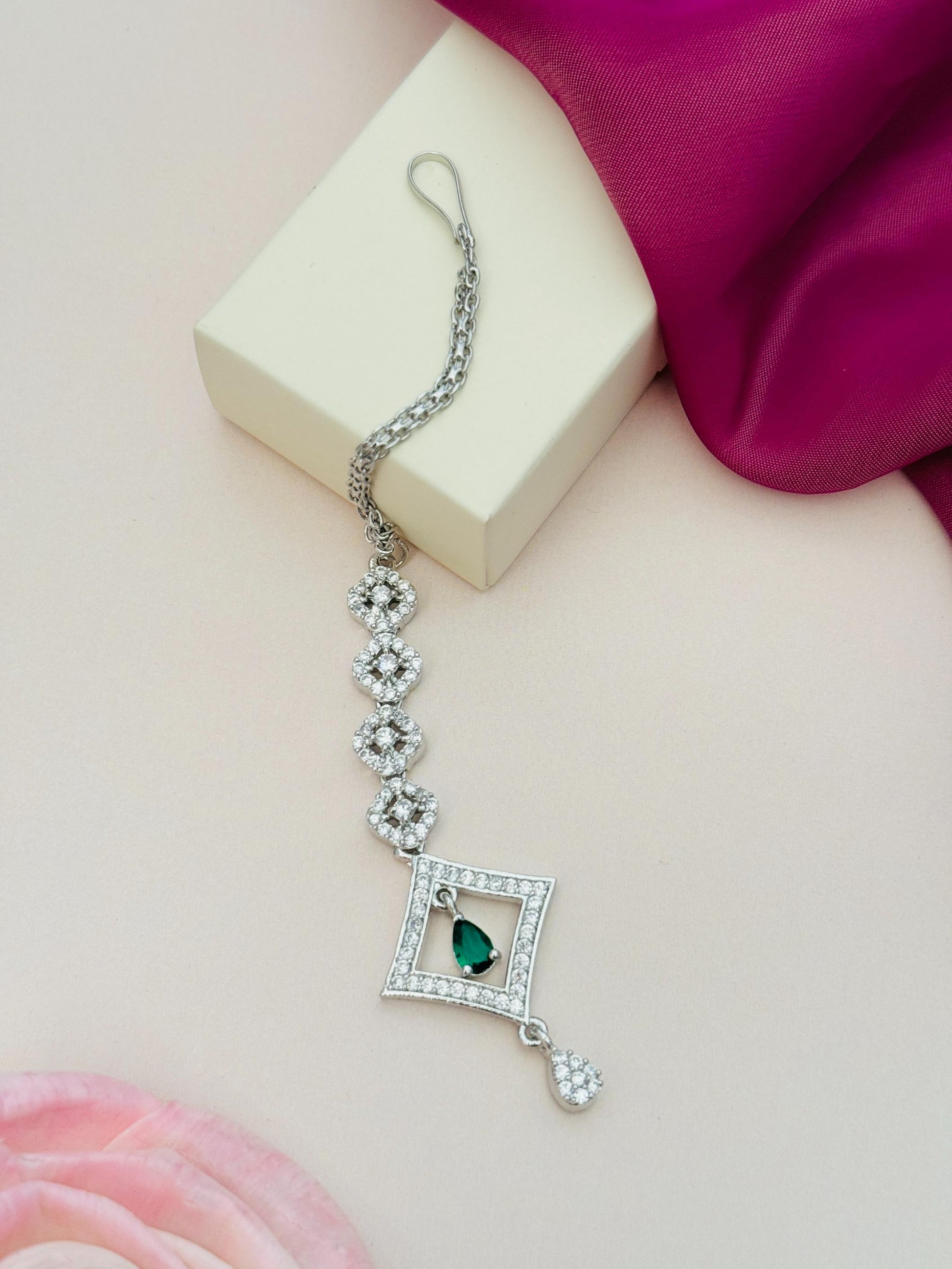 Silver Plated American Diamond Maangtikka with green stone and intricate design by Abdesignsjewellery