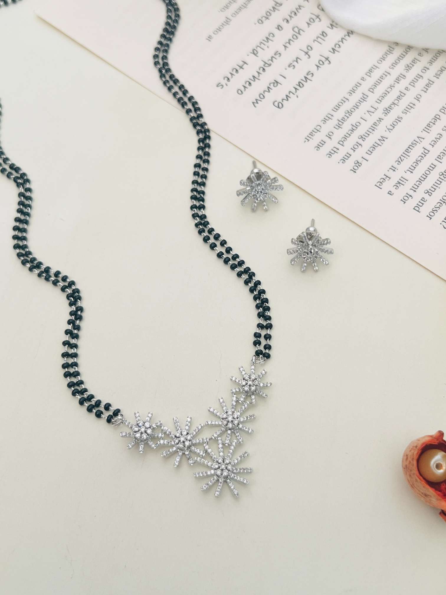 Silver Plated American Diamond Mangalsutra Set with black beads and floral pendant design by Abdesignsjewellery