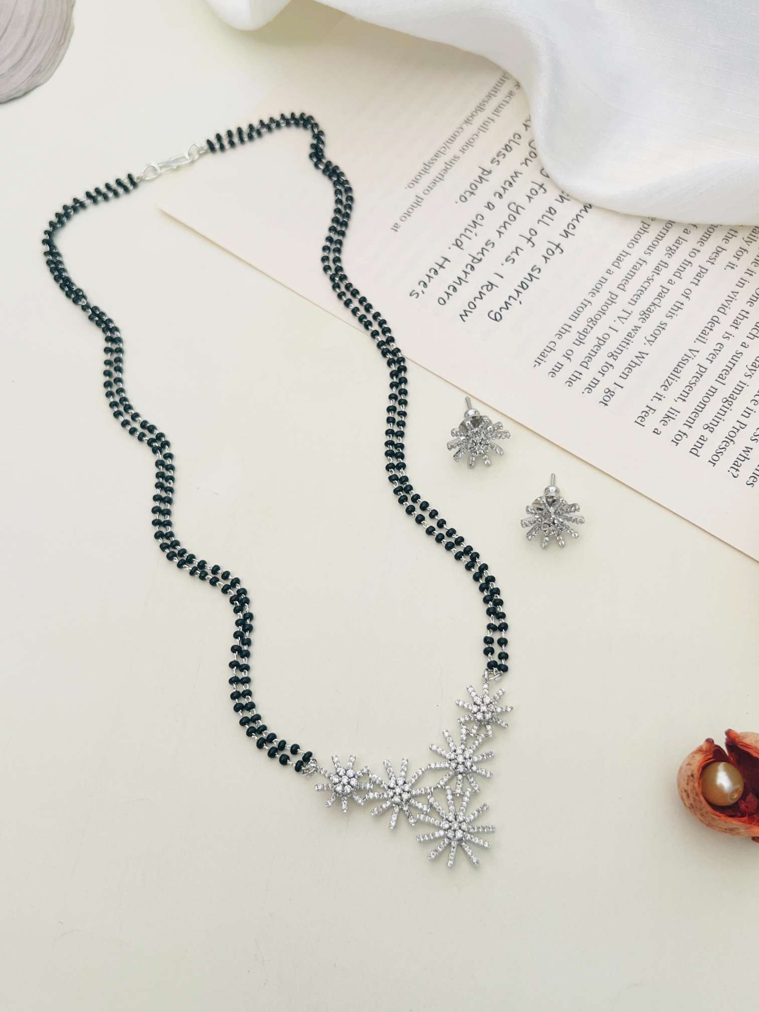 Silver Plated American Diamond Mangalsutra Set with floral pendant and matching earrings by Abdesignsjewellery