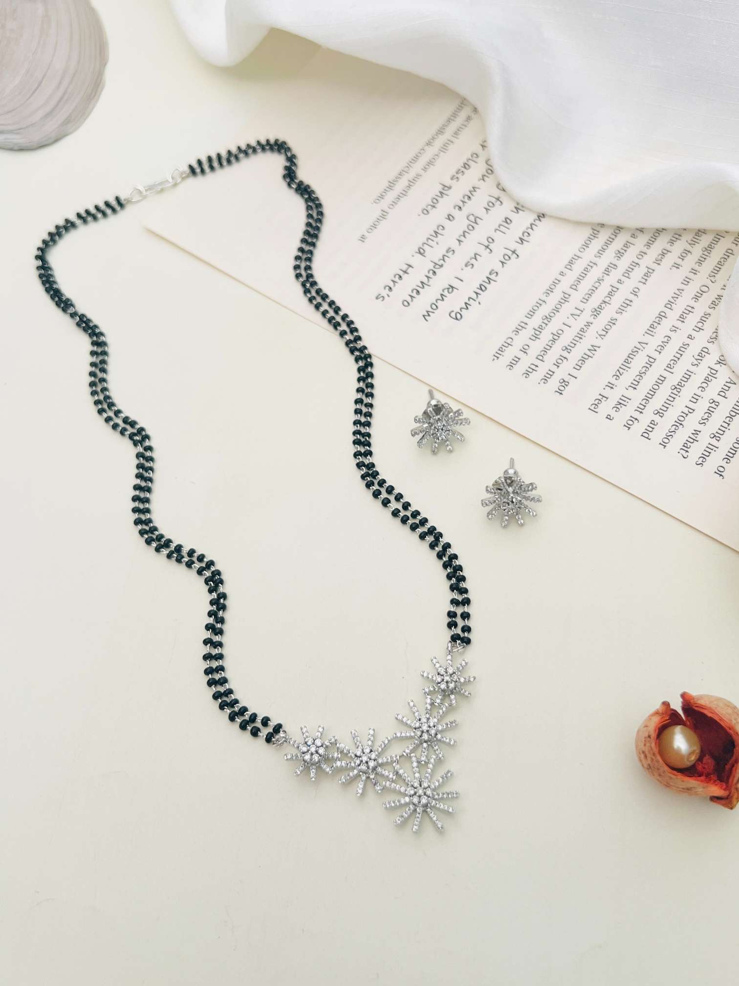 Silver Plated American Diamond Mangalsutra Set with floral design and matching earrings by Abdesignsjewellery