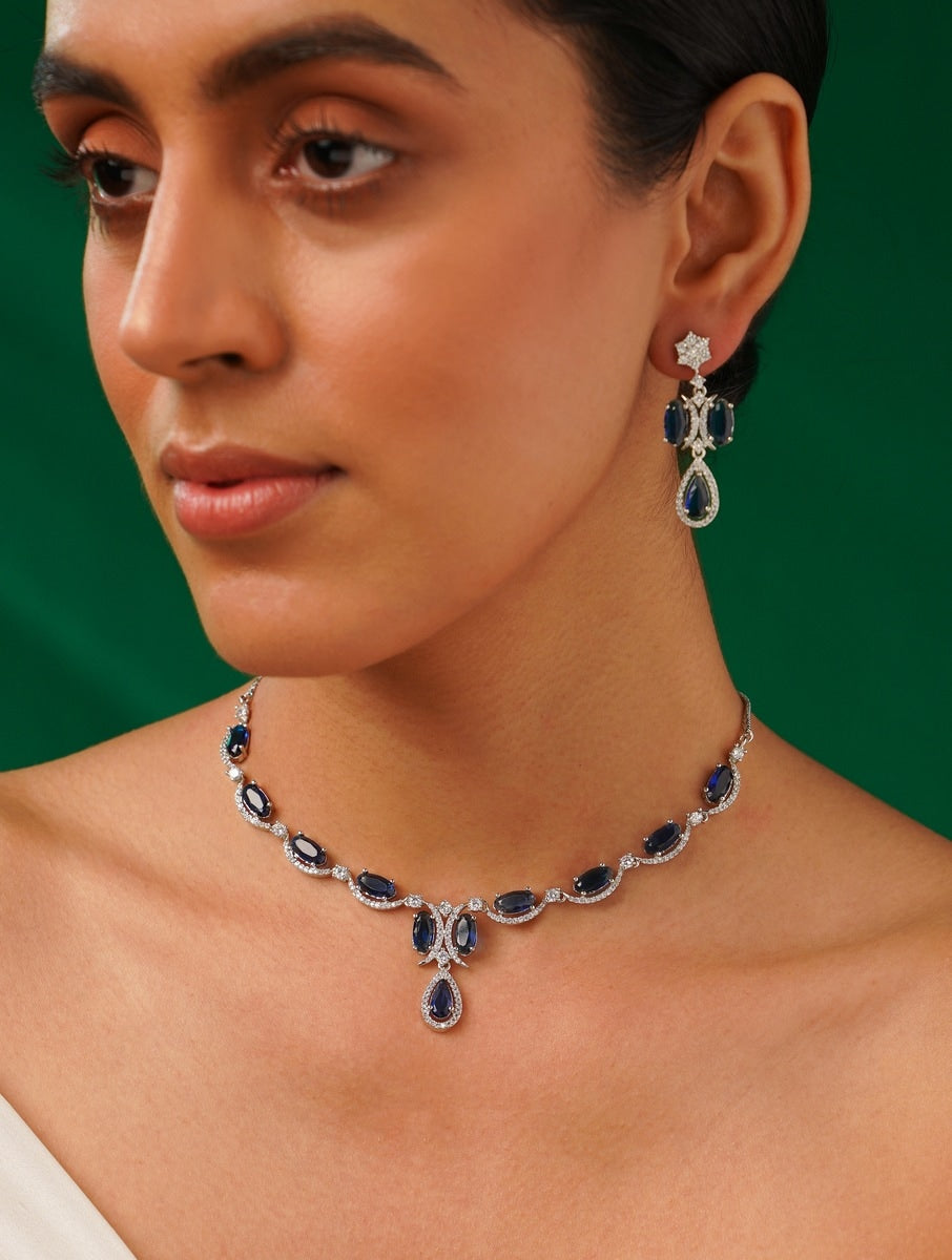 Silver Plated American Diamond Necklace with blue stones worn by woman from Abdesignsjewellery
