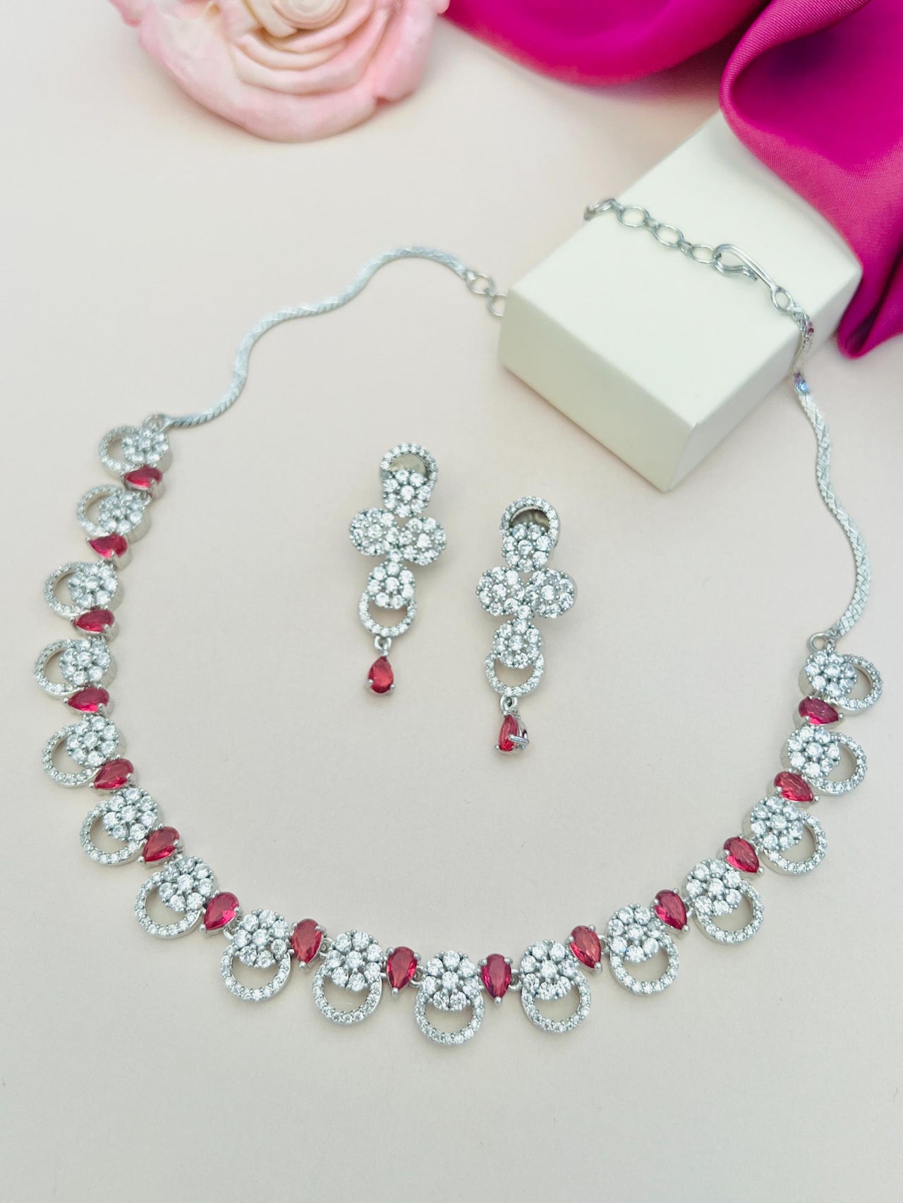 Silver Plated American Diamond Necklace with matching earrings featuring red teardrop stones by Abdesignsjewellery