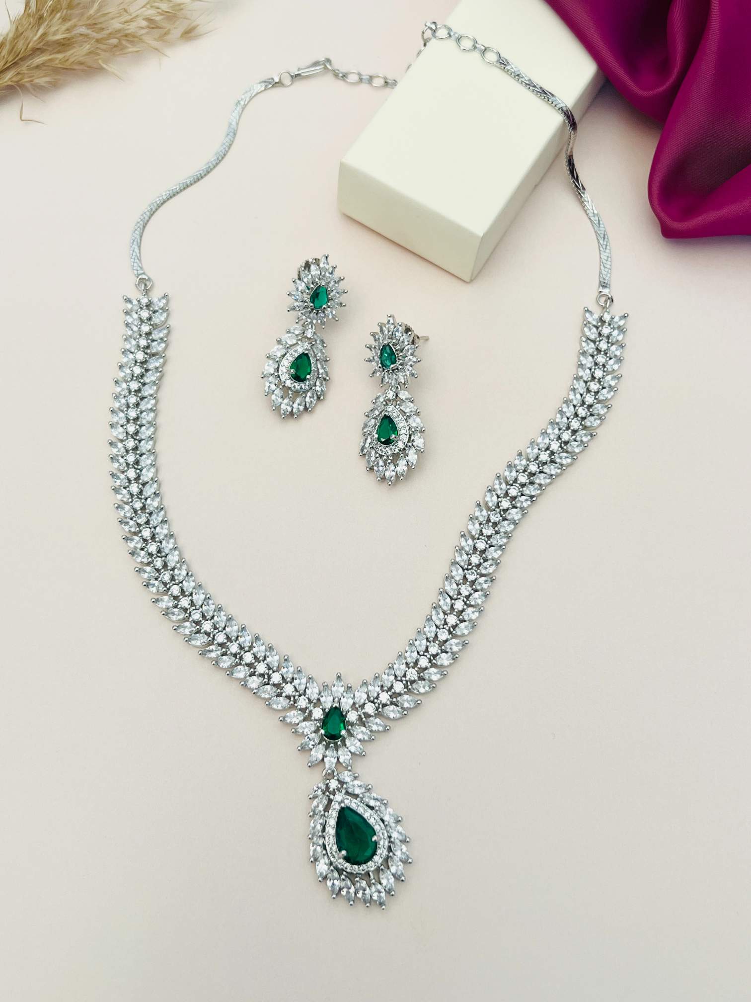 Silver Plated American Diamond Necklace Set featuring green gemstones with matching earrings by Abdesignsjewellery