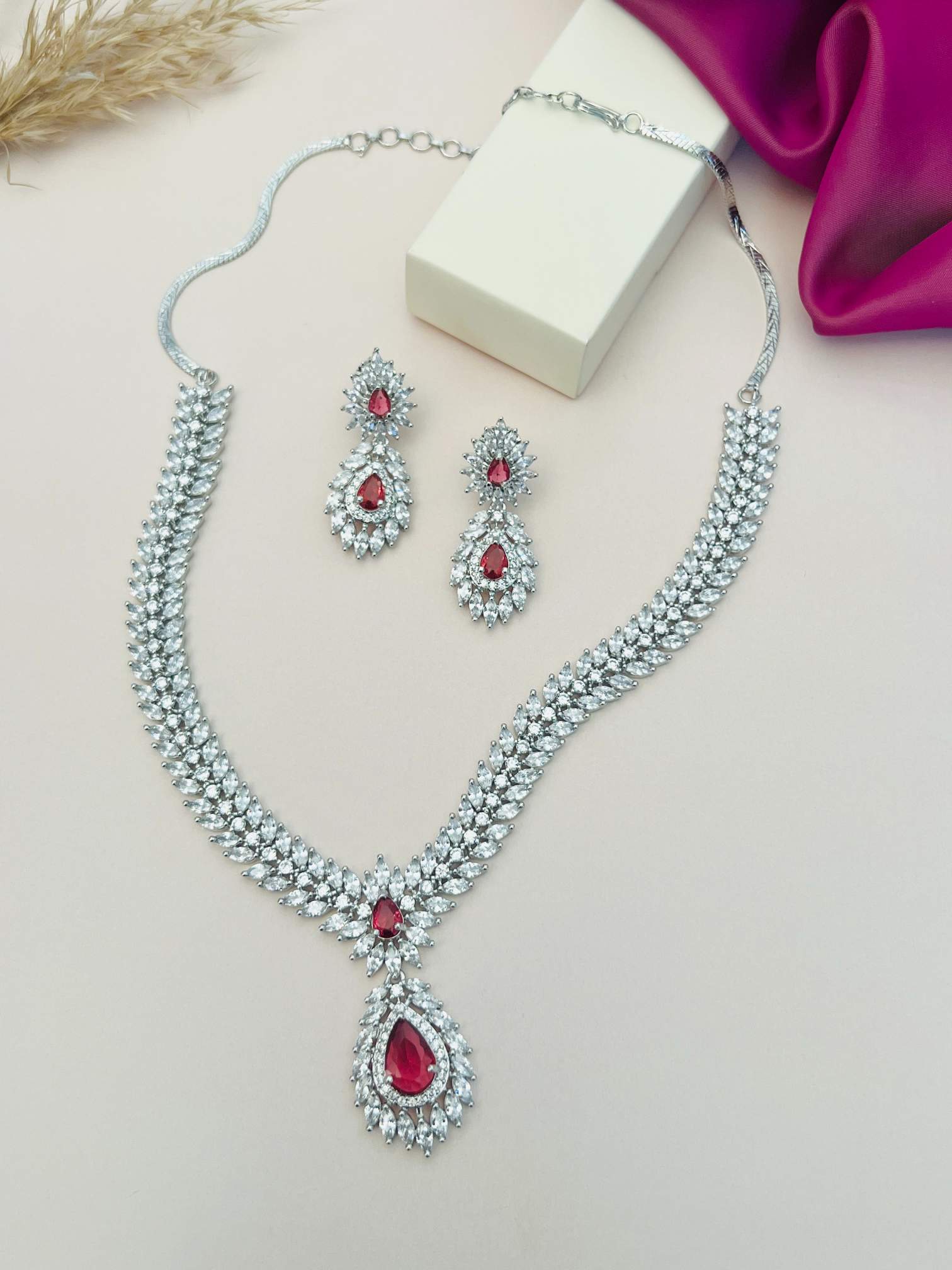 Silver Plated American Diamond Necklace Set with red gemstone accents and matching earrings by Abdesignsjewellery